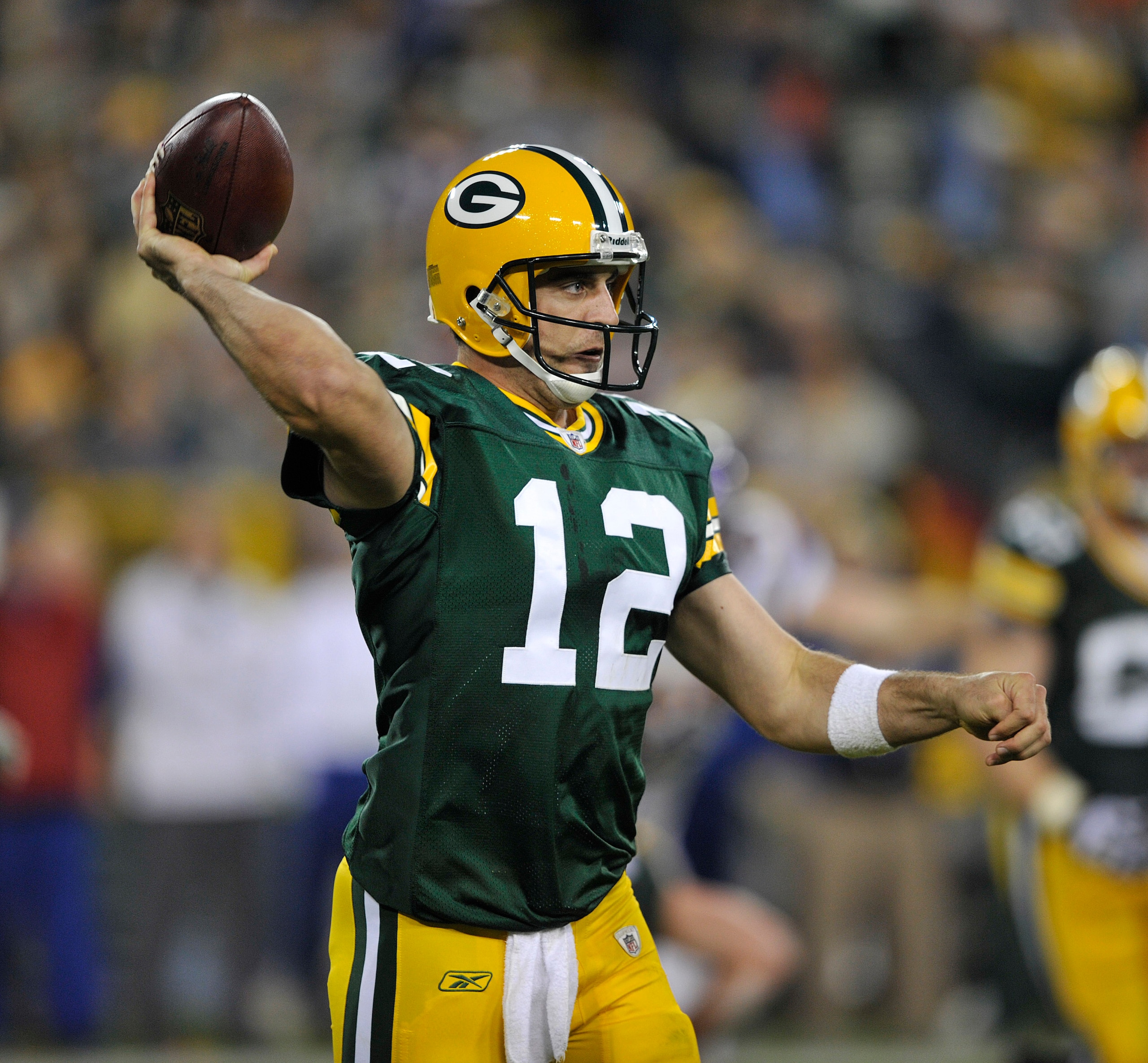 GREEN BAY, WI - OCTOBER 24:   Aaron Rodgers #12 of the Green Bay Packers passes against the Minnesota Vikings at Lambeau Field on October 24, 2010 in Green Bay, Wisconsin. (Photo by Jim Prisching/Getty Images)