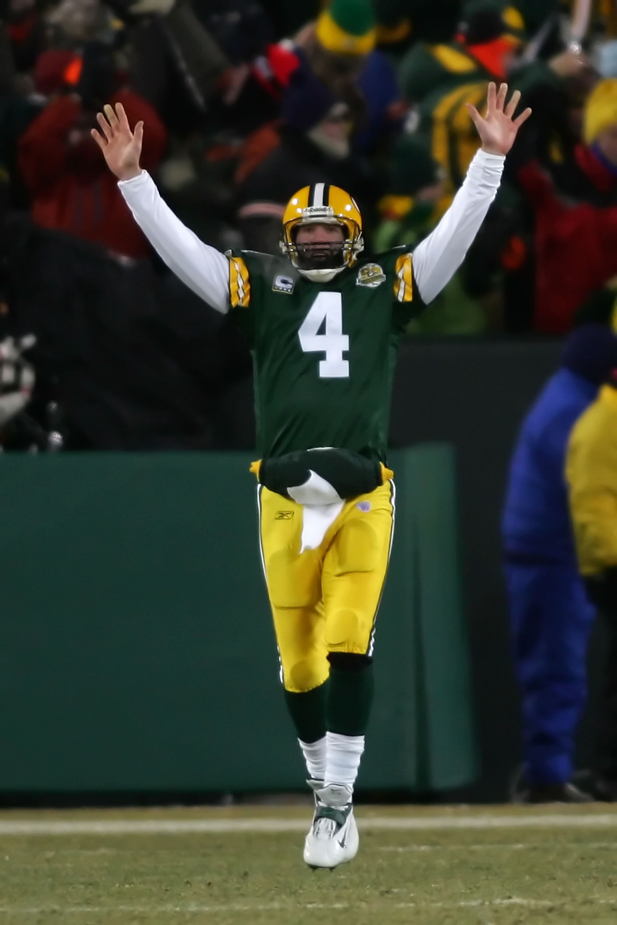 GREEN BAY, WI - JANUARY 20:  Quarterback Brett Favre #4 of the Green Bay Packers celebrates after throwing a 90 yard touchdown reception against the New York Giants during the NFC championship game on January 20, 2008 at Lambeau Field in Green Bay, Wiscon