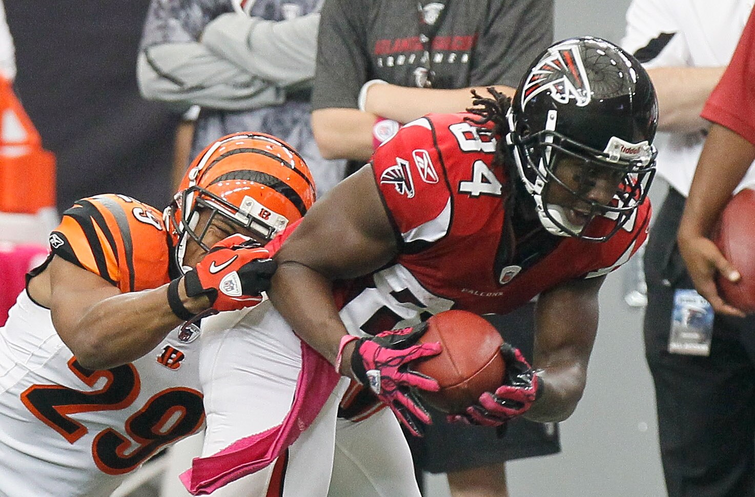 ATLANTA - OCTOBER 24:  Roddy White #84 of the Atlanta Falcons is tackled by Leon Hall #29 of the Cincinnati Bengals at Georgia Dome on October 24, 2010 in Atlanta, Georgia.  (Photo by Kevin C. Cox/Getty Images)