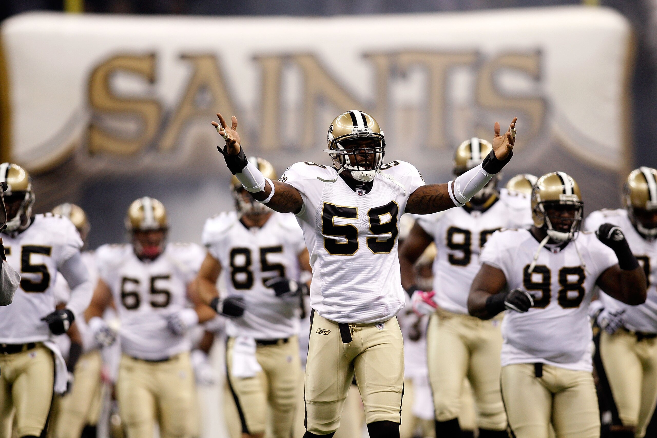 NEW ORLEANS - OCTOBER 24:  Anthony Waters #59 of the New Orleans Saints runs on the field during player introductions before playing against the Cleveland Browns at the Louisiana Superdome on October 24, 2010 in New Orleans, Louisiana.  The Browns defeate