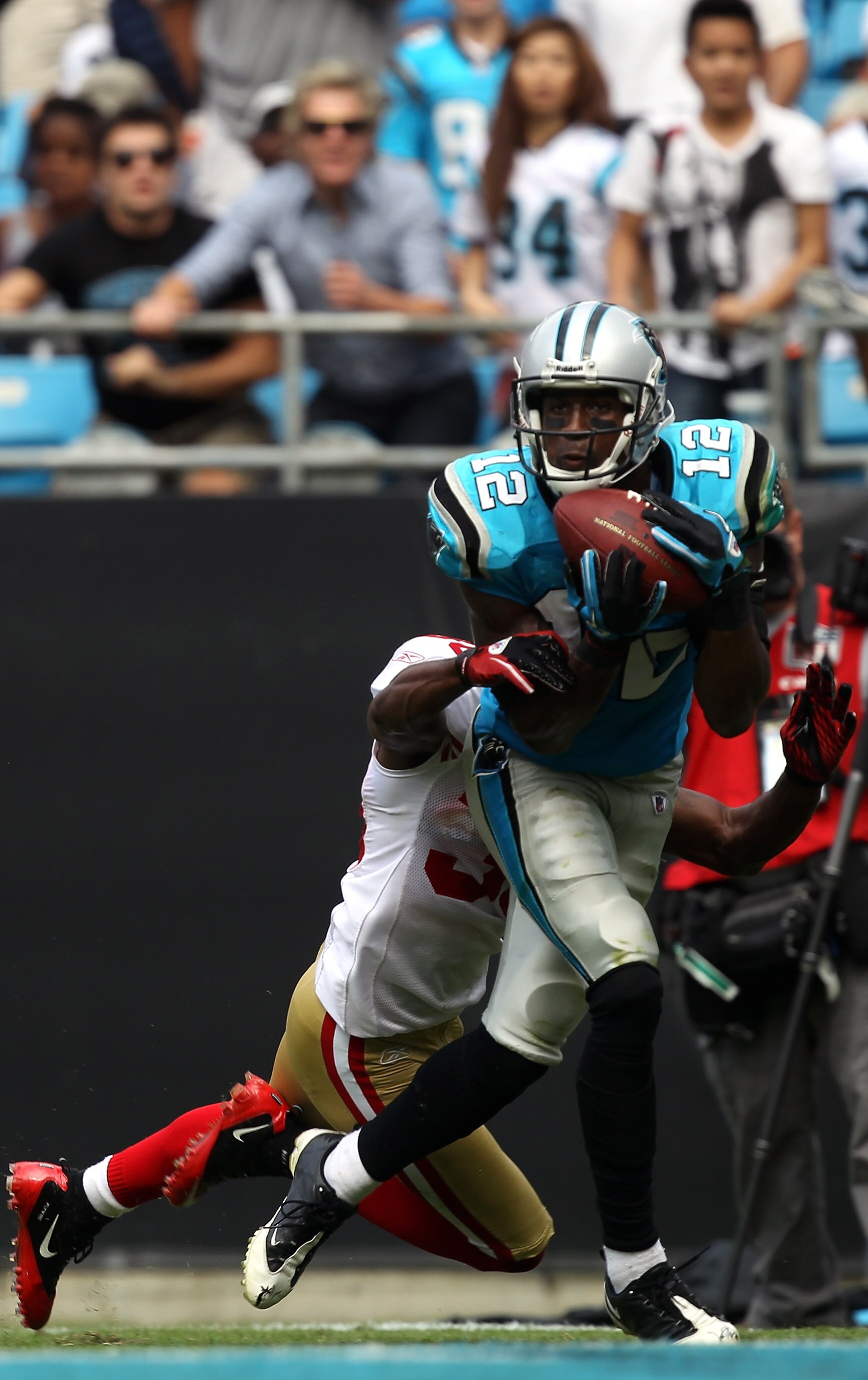 CHARLOTTE, NC - OCTOBER 24:  David Gettis #12 of the Carolina Panthers catches a touchdown late in the fourth quarter against the San Francisco 49ers during their game at Bank of America Stadium on October 24, 2010 in Charlotte, North Carolina.  (Photo by