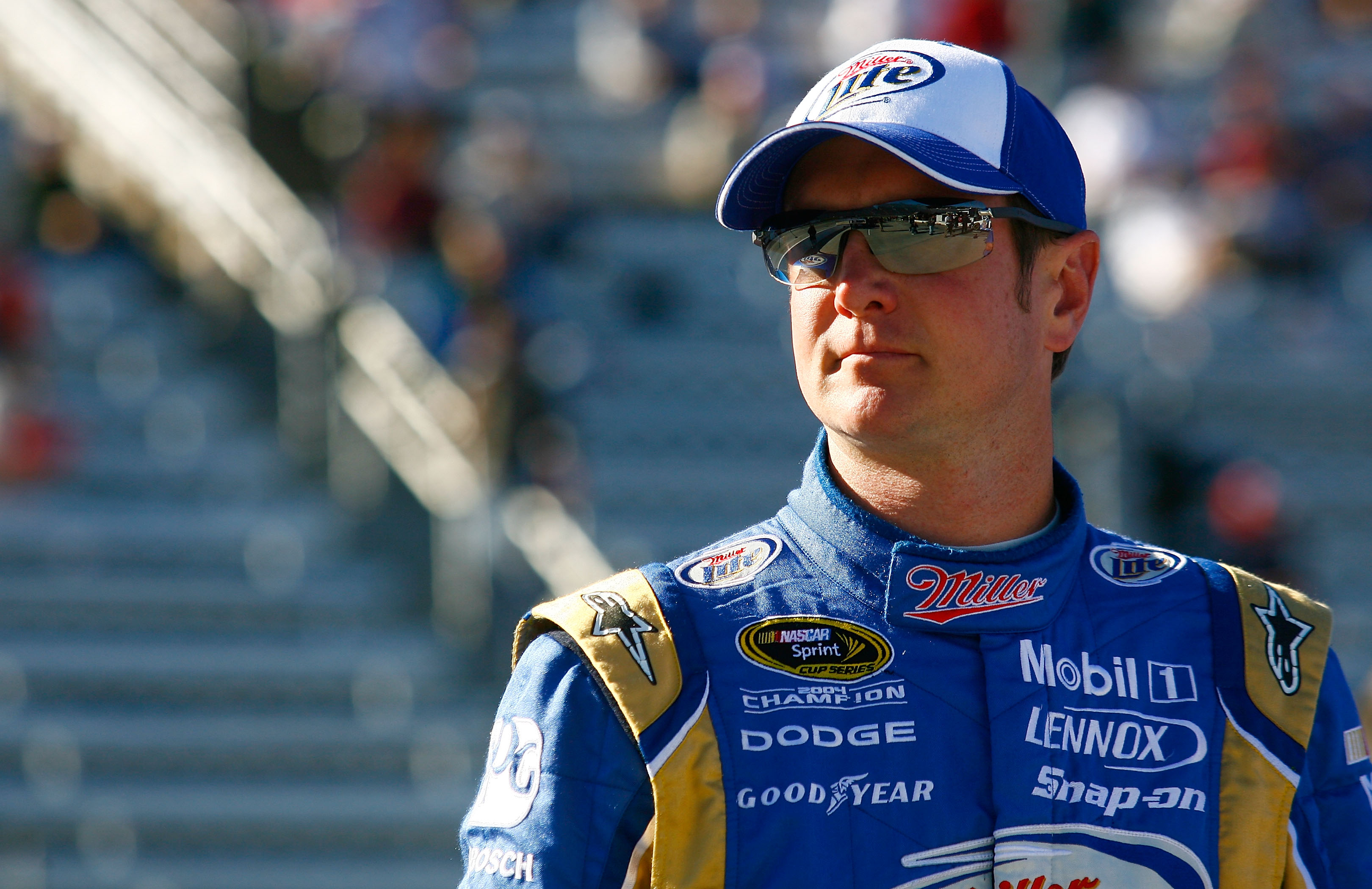 MARTINSVILLE, VA - OCTOBER 22:  Kurt Busch, driver of the #2 Operation Home Front/Miller Lite Dodge, stands next to his car on pit road during qualifying for the NASCAR Sprint Cup Series TUMS Fast Relief 500 at Martinsville Speedway on October 22, 2010 in