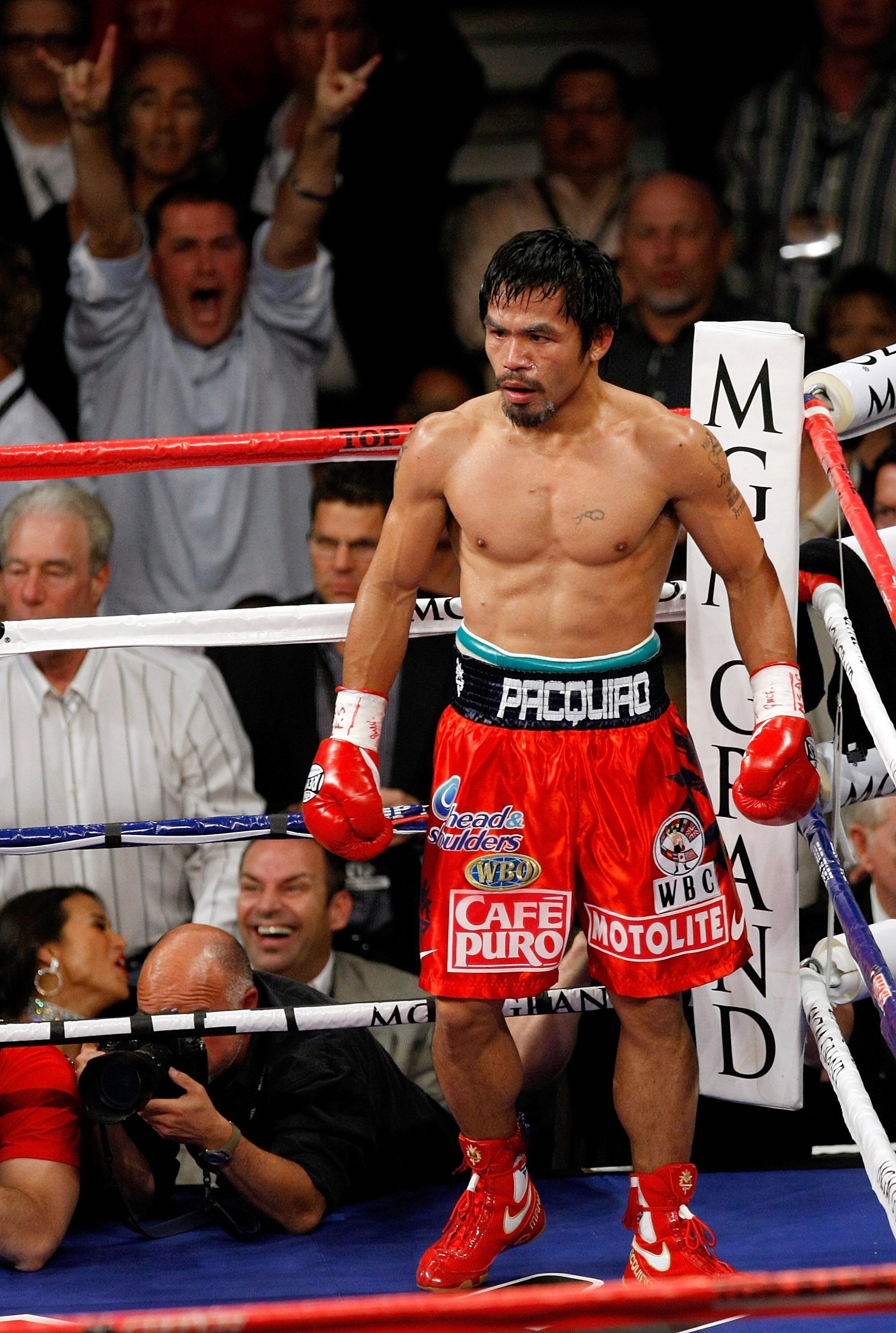 LAS VEGAS - NOVEMBER 14:  Manny Pacquiao stands in a neutral corner after knocking Miguel Cotto down in the third round during their WBO welterweight title fight at the MGM Grand Garden Arena on November 14, 2009 in Las Vegas, Nevada. Pacquiao defeated Co