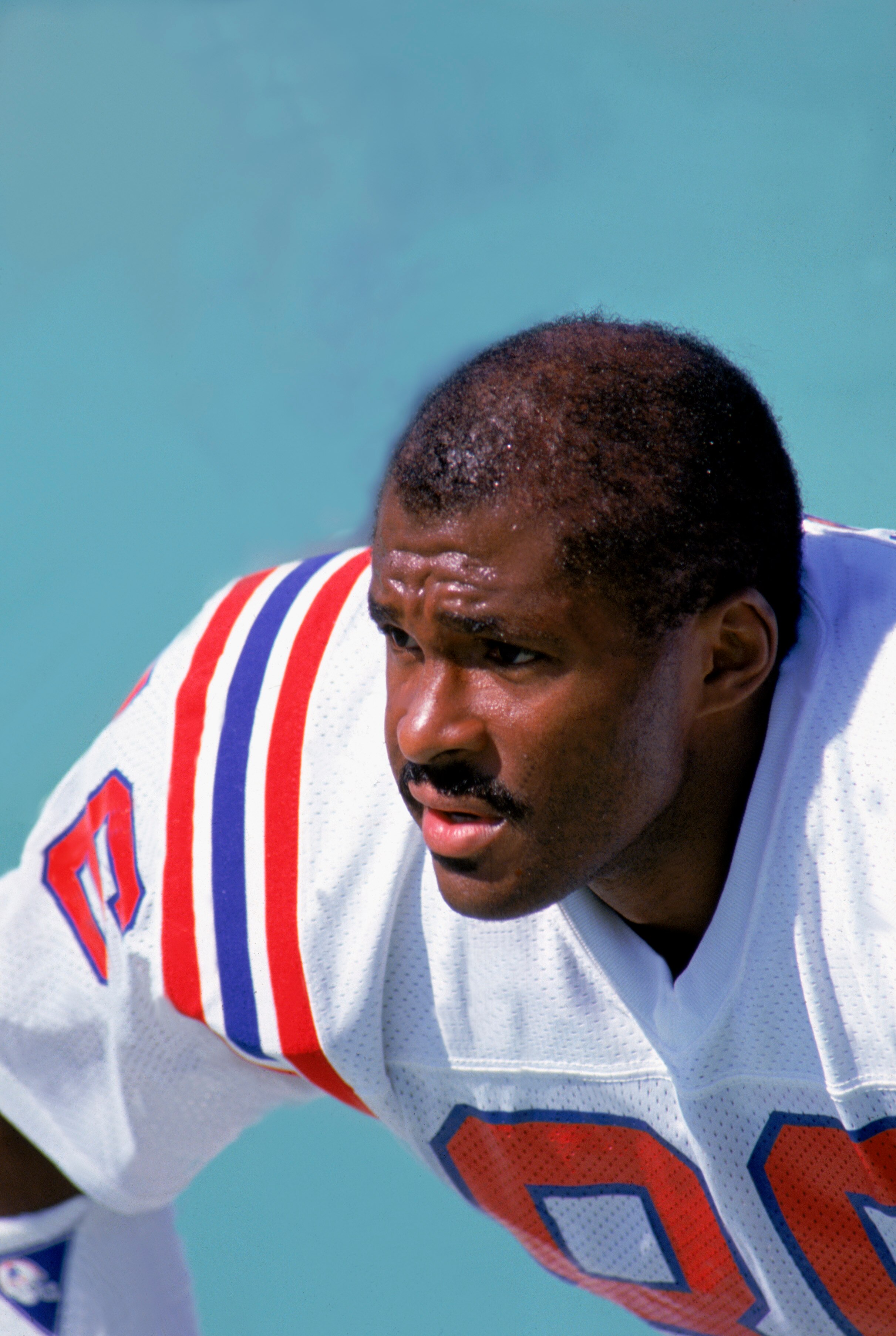 BUFFALO, NY - 1989:  Portrait of wide receiver Stanley Morgan #86 of the New England Patriots as he sits on the sideline during a 1989 NFL game against the Buffalo Bills at Rich Stadium  in Buffalo, New York.  The Bills defeated the Pats 31-10.  (Photo by