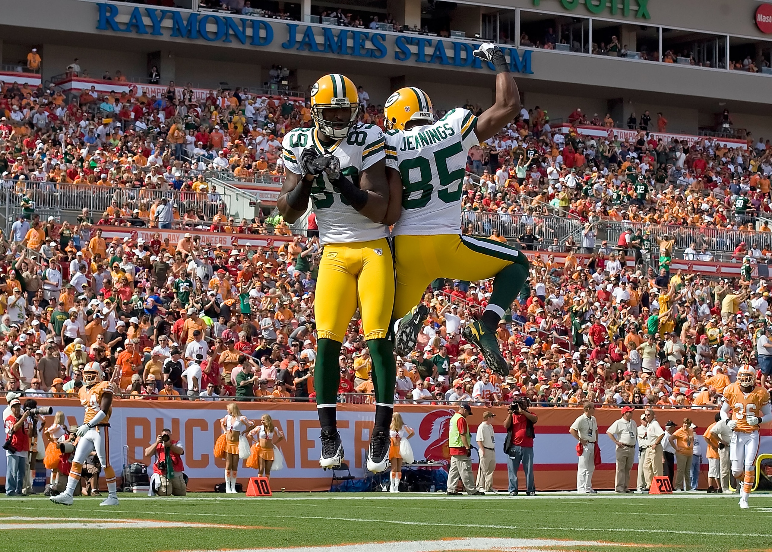 TAMPA, FL - NOVEMBER 08:  Receivers James Jones #89 and Greg Jennings #85 of the Green Bay Packers celebrate Jones' first quarter touchdown against the Tampa Bay Buccaneers during the game at Raymond James Stadium on November 8, 2009 in Tampa, Florida.  (