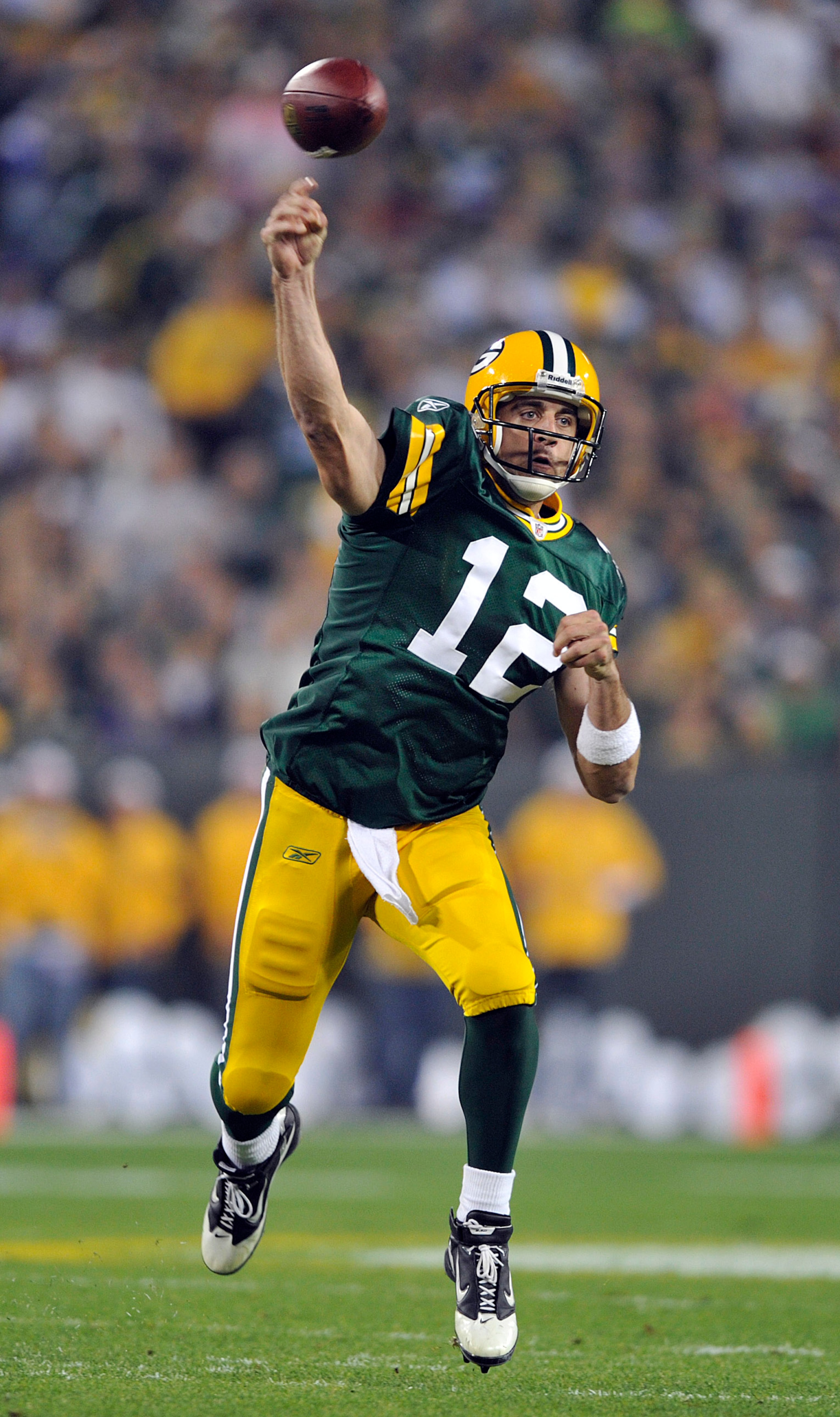 GREEN BAY, WI - OCTOBER 24:  Aaron Rodgers #12 of the Green Bay Packers passes against the Minnesota Vikings at Lambeau Field on October 24, 2010 in Green Bay, Wisconsin. (Photo by Jim Prisching/Getty Images)