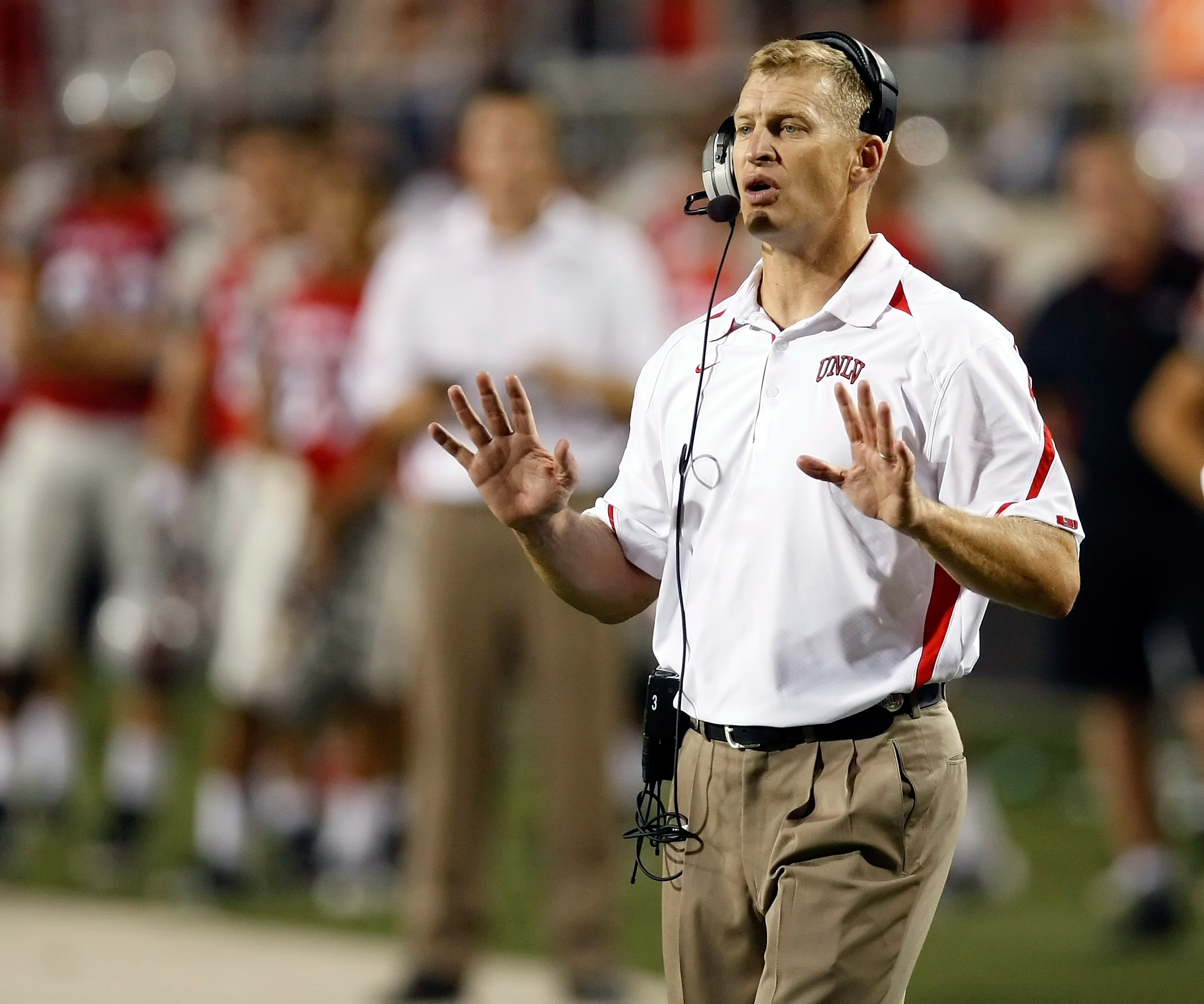 LAS VEGAS - OCTOBER 02:  UNLV Rebels head coach Bobby Hauck gestures to his players during their game against the Nevada Reno Wolf Pack at Sam Boyd Stadium October 2, 2010 in Las Vegas, Nevada. Nevada Reno won 44-26.  (Photo by Ethan Miller/Getty Images)