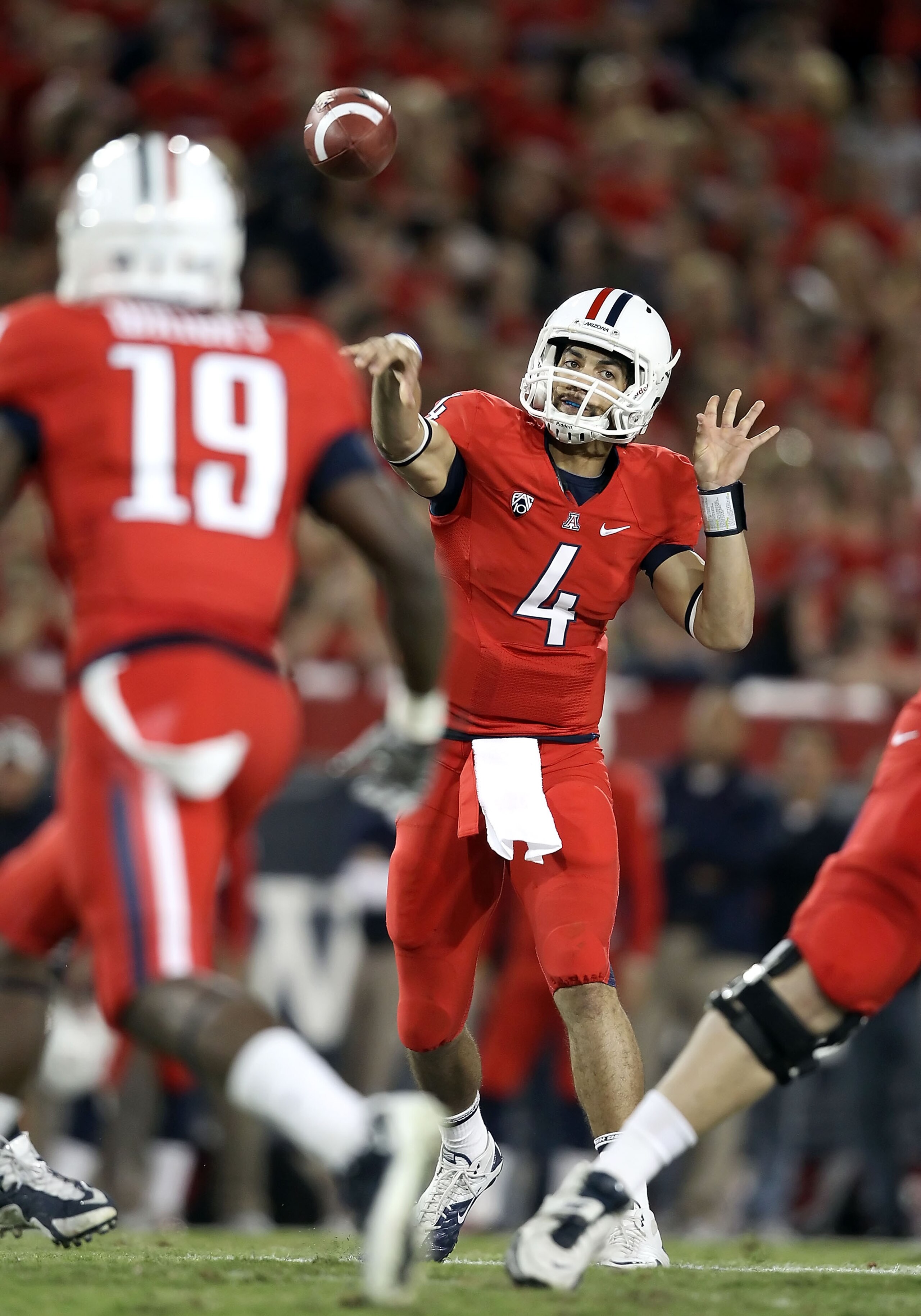 TUCSON, AZ - OCTOBER 23: Quarterback Matt Scott #4 of the Arizona Wildcats throws a pass during the college football game against the Washington Huskies at Arizona Stadium on October 23, 2010 in Tucson, Arizona. (Photo by Christian Petersen/Getty Images TUCSON, AZ - OCTOBER 23: Quarterback Matt Scott #4 of the Arizona Wildcats throws a pass during the college football game against the Washington Huskies at Arizona Stadium on October 23, 2010 in Tucson, Arizona. (Photo by Christian Petersen/Getty Images