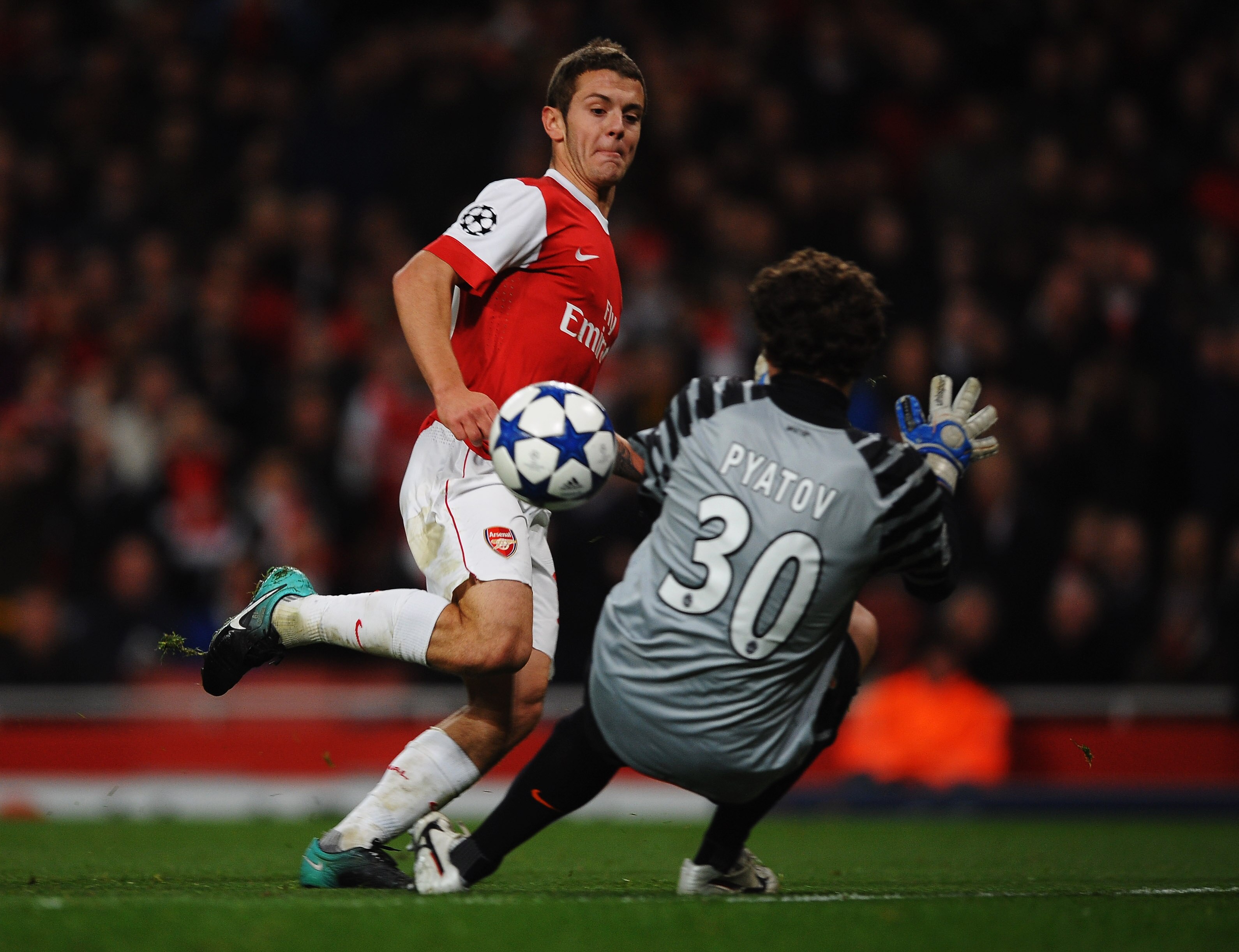LONDON, ENGLAND - OCTOBER 19: Jack Wilshere of Arsenal shoots past Andriy Pyatov of Shakhtar Donetsk to score their fourth goal during the UEFA Champions League Group H match between Arsenal and FC Shakhtar Donetsk at the Emirates Stadium on October 19, LONDON, ENGLAND - OCTOBER 19: Jack Wilshere of Arsenal shoots past Andriy Pyatov of Shakhtar Donetsk to score their fourth goal during the UEFA Champions League Group H match between Arsenal and FC Shakhtar Donetsk at the Emirates Stadium on October 19,