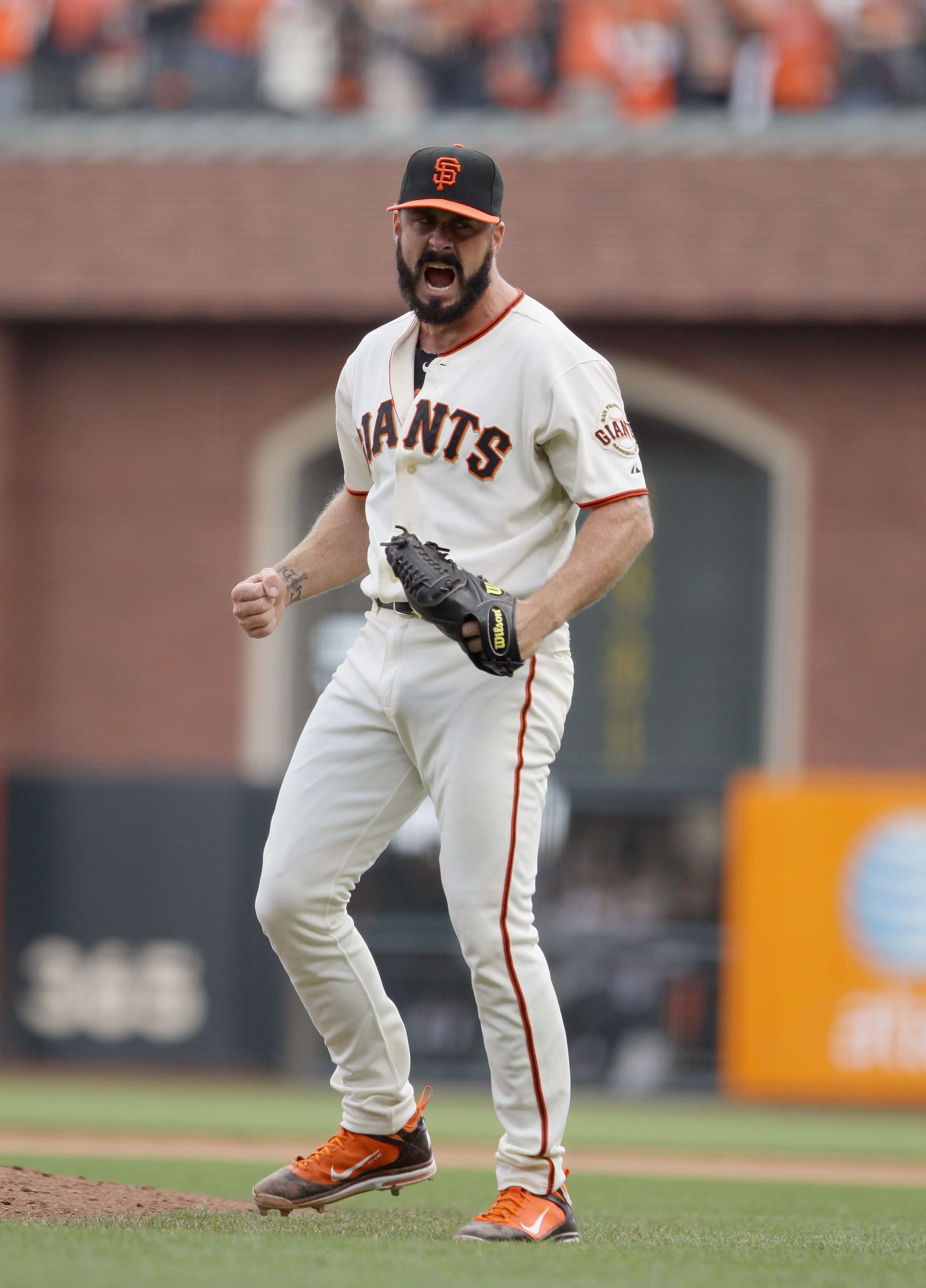 SAN FRANCISCO - OCTOBER 03: Brian Wilson #38 of the San Francisco Giants celebrates after they beat the San Diego Padres to win the National League West Title at AT&T Park on October 3, 2010 in San Francisco, California.  (Photo by Ezra Shaw/Getty Images)