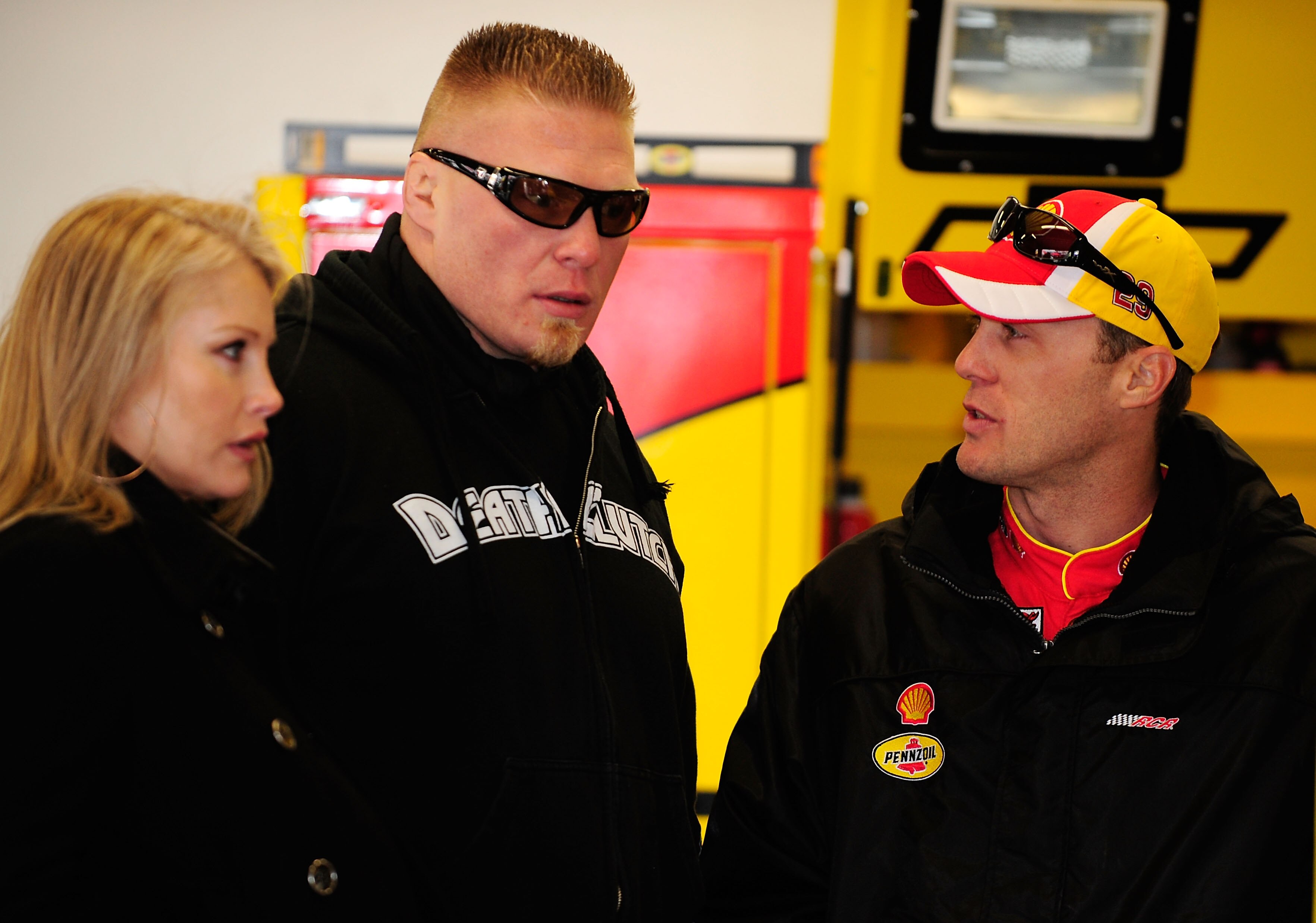 DAYTONA BEACH, FL - FEBRUARY 13:  MMA fighter Brock Lesnar(C)  speaks with Kevin Harvick(R), driver of the #29 Shell/Pennzoil Chevrolet, during practice for the Daytona 500 at Daytona International Speedway on February 13, 2010 in Daytona Beach, Florida. 