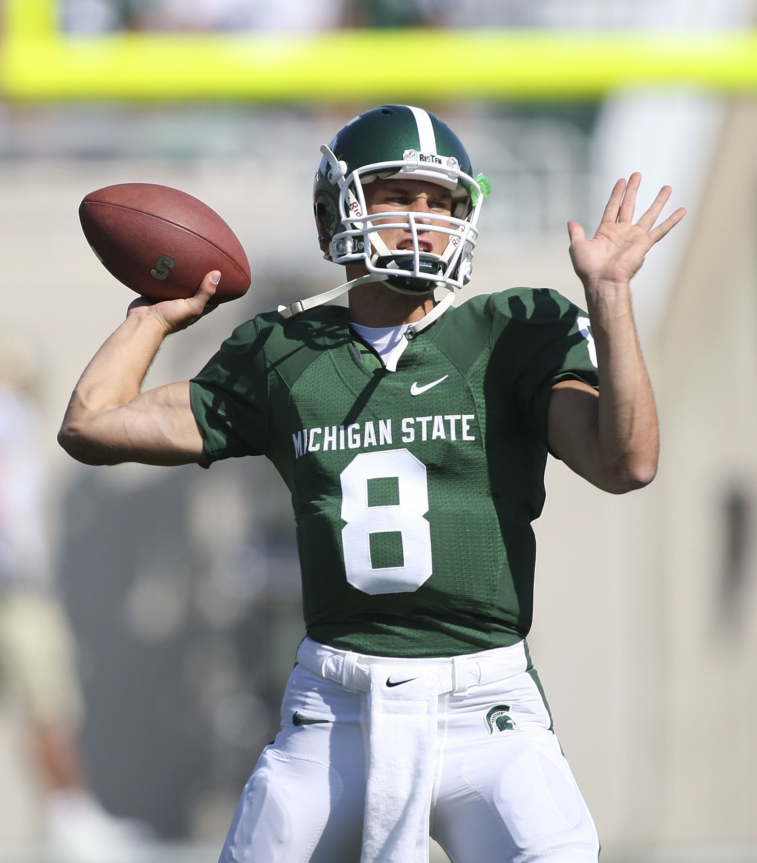 EAST LANSING, MI - SEPTEMBER 05:  Quarterback Kirk Cousins #8 of the Michigan State Spartans warms up prior to the start of the game against the Montana State Bobcats on September 5, 2009 at Spartan Stadium in East Lansing, Michigan.  (Photo by Leon Halip