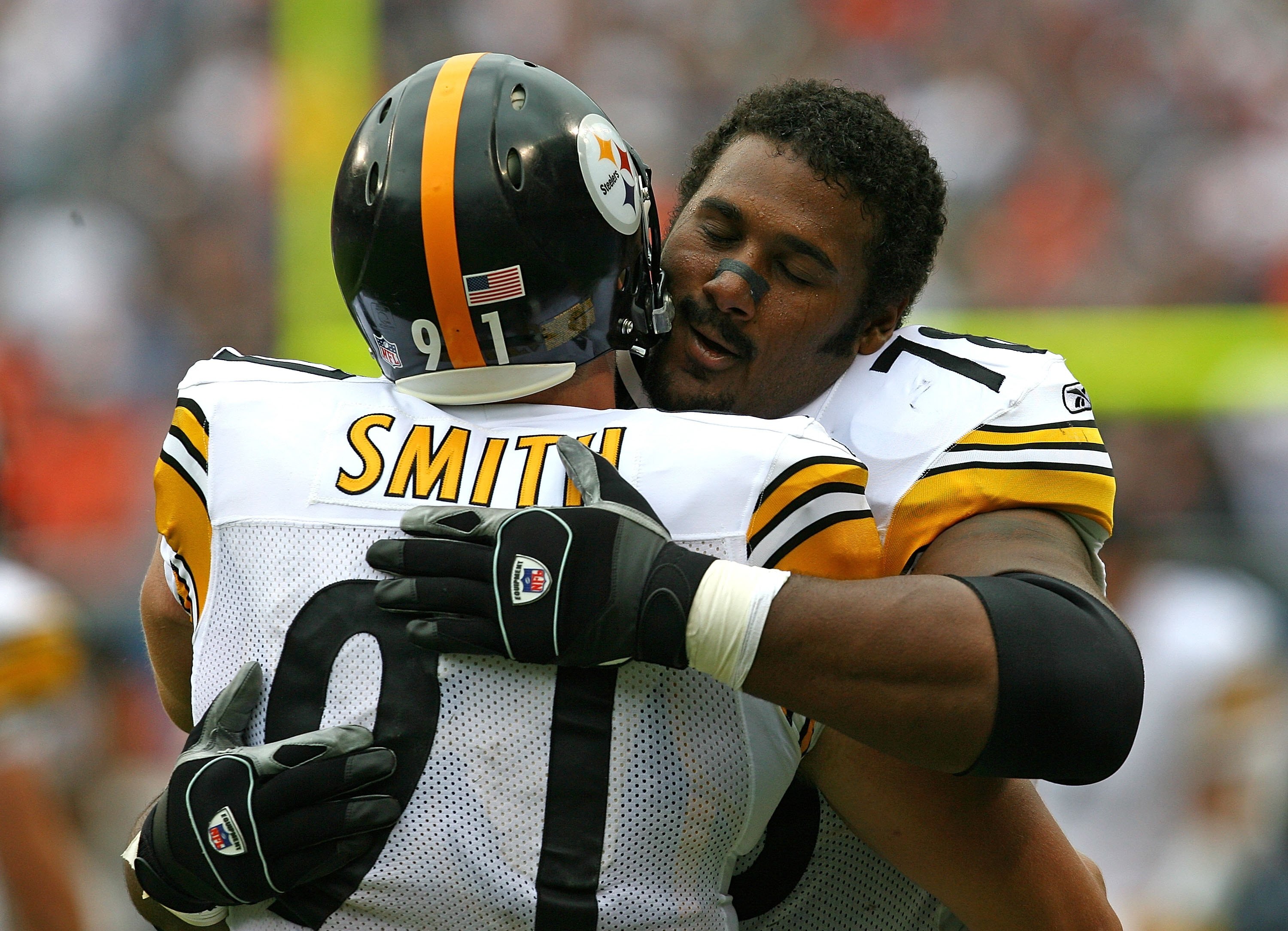CHICAGO - SEPTEMBER 20: Max Starks #78 of the Pittsburgh Steelers hugs teammate Aaron Smith #91 before a game against the Chicago Bears on September 20, 2009 at Soldier Field in Chicago, Illinois. The Bears defeated the Steelers 17-14. (Photo by Jonathan