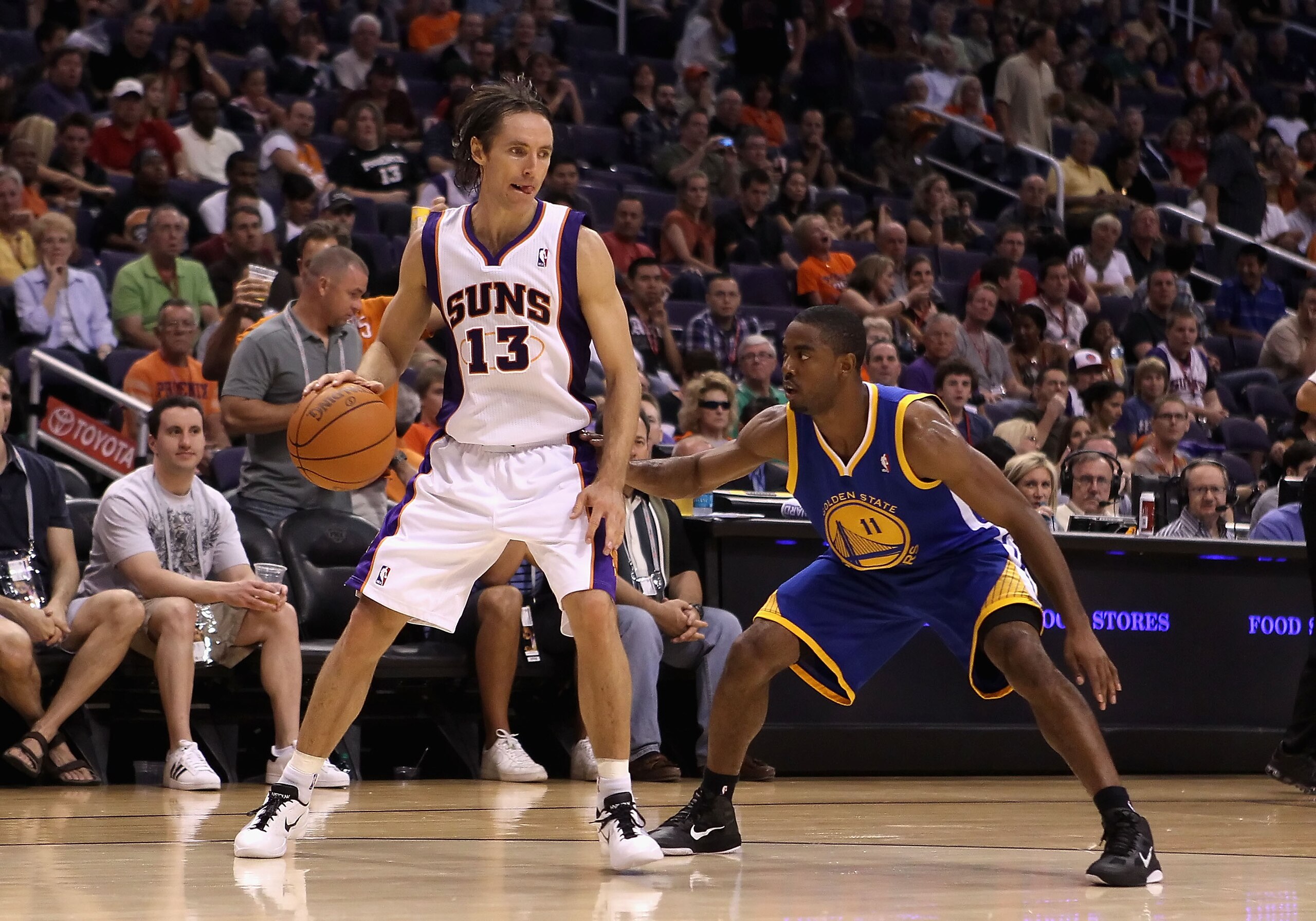 PHOENIX - OCTOBER 19:  Steve Nash #13 of the Phoenix Suns handles the ball during the preseason NBA game against the Golden State Warriors at US Airways Center on October 19, 2010 in Phoenix, Arizona. NOTE TO USER: User expressly acknowledges and agrees t