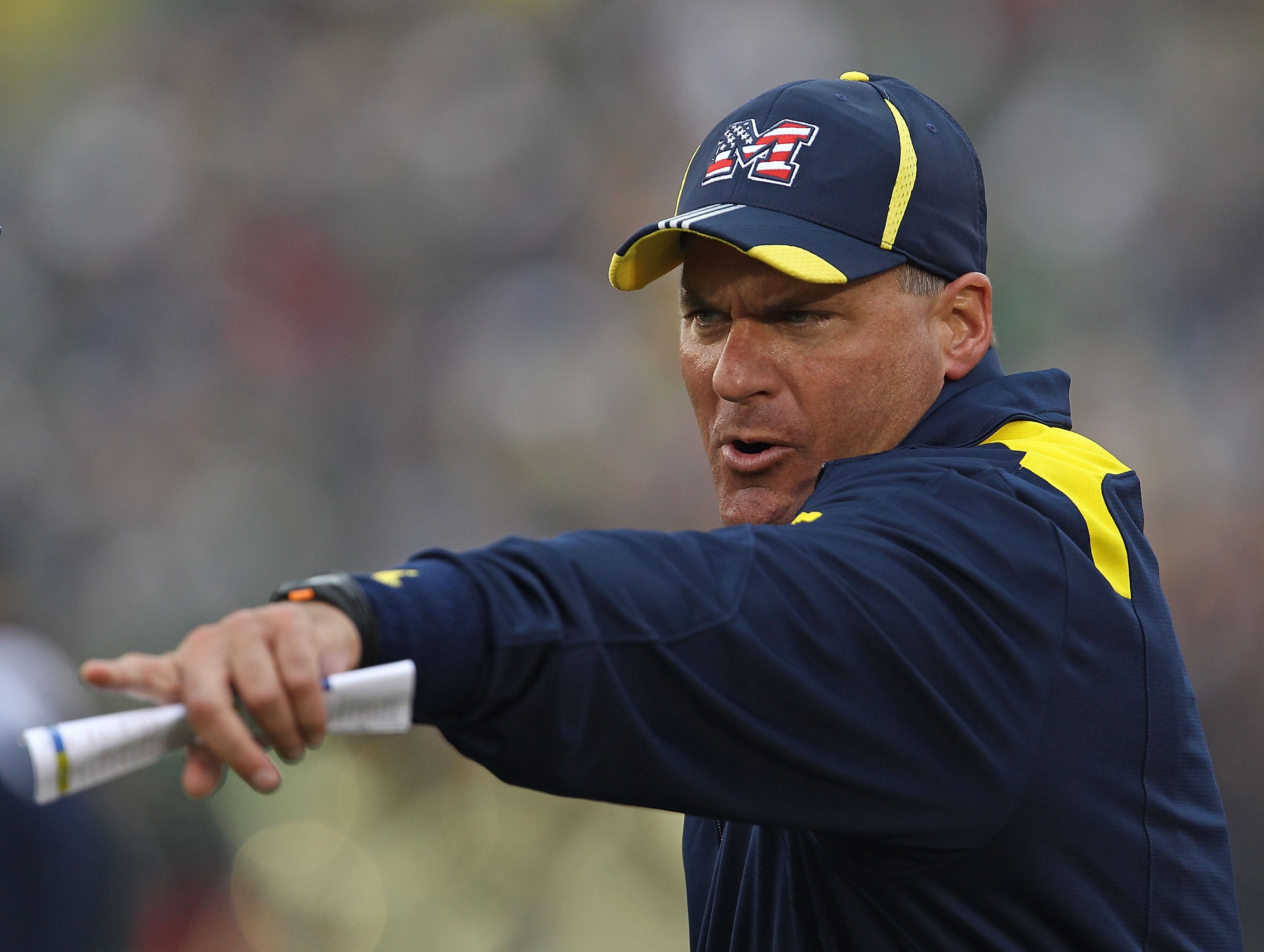 SOUTH BEND, IN - SEPTEMBER 11: Head coach Rich Rodriguez of the Michigan Wolverines yells at a player during a game against the Notre Dame Fighting Irish at Notre Dame Stadium on September 11, 2010 in South Bend, Indiana. Michigan defeated Notre Dame 28-2