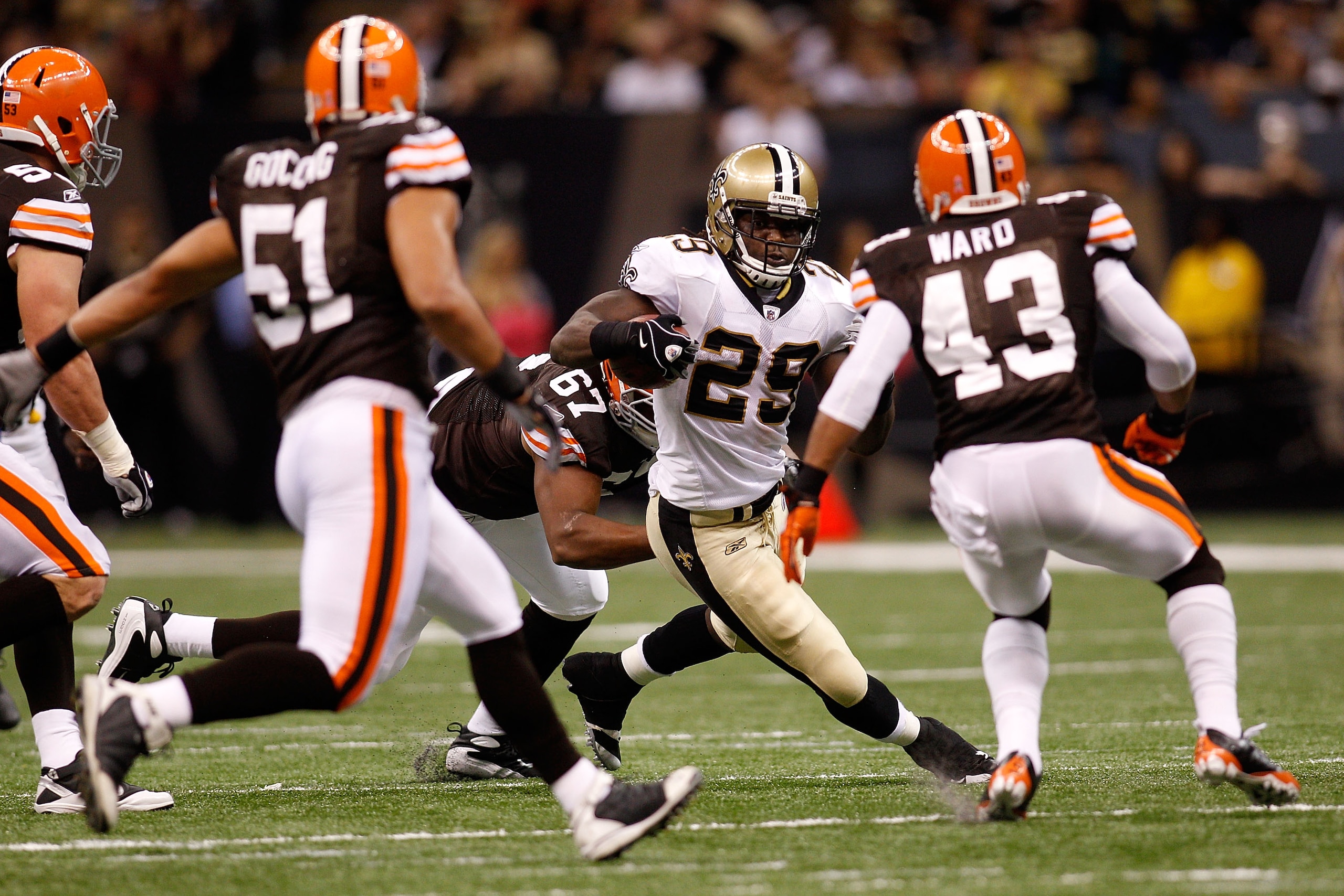 NEW ORLEANS - OCTOBER 24: Chris Ivory #29 of the New Orleans Saints avoids a tackle by Derreck Robinson #67 and T.J. Ward #43 of the Cleveland Browns at the Louisiana Superdome on October 24, 2010 in New Orleans, Louisiana. (Photo by Chris Graythen/Gett NEW ORLEANS - OCTOBER 24: Chris Ivory #29 of the New Orleans Saints avoids a tackle by Derreck Robinson #67 and T.J. Ward #43 of the Cleveland Browns at the Louisiana Superdome on October 24, 2010 in New Orleans, Louisiana. (Photo by Chris Graythen/Gett