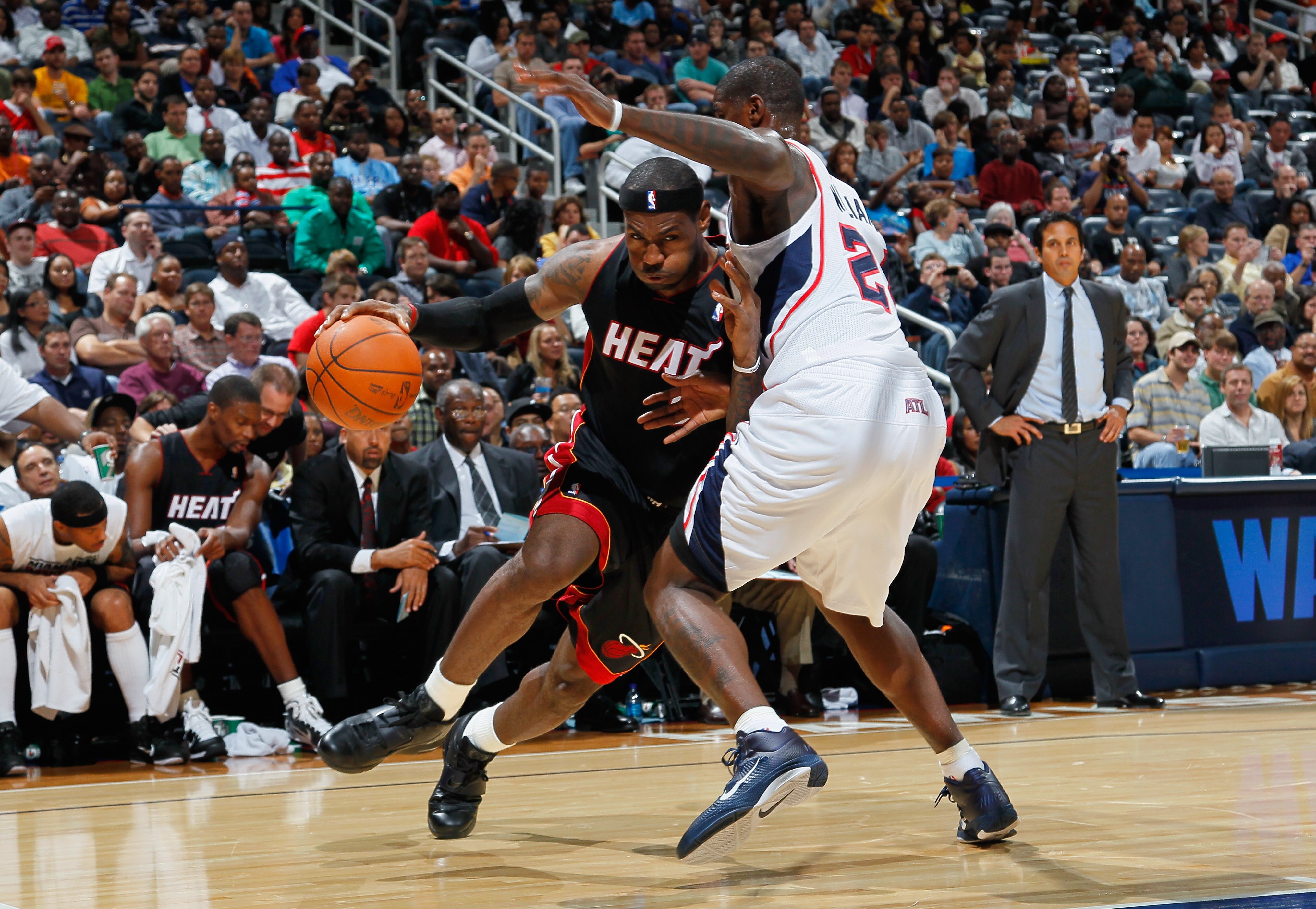 ATLANTA - OCTOBER 21:  LeBron James #6 of the Miami Heat drives the basket against Marvin Williams #24 of the Atlanta Hawks at Philips Arena on October 21, 2010 in Atlanta, Georgia.  (Photo by Kevin C. Cox/Getty Images)