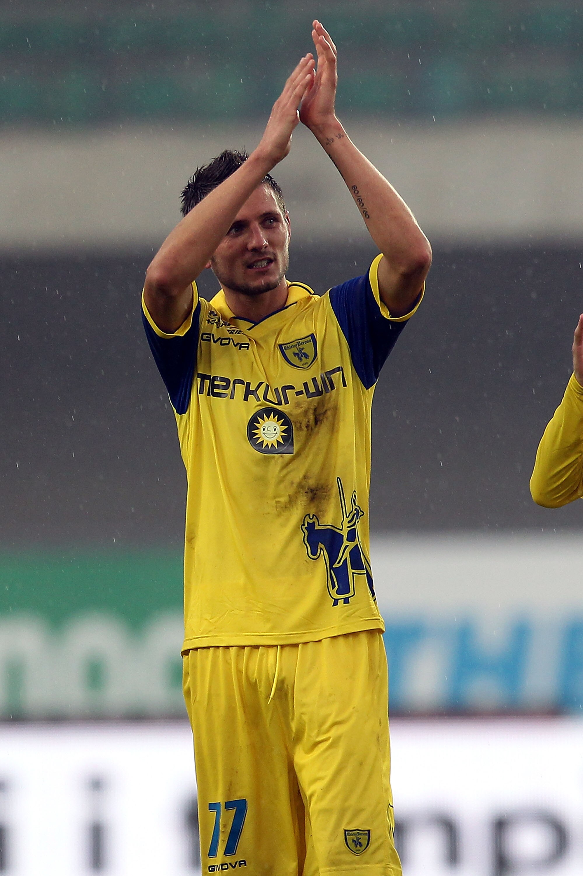 VERONA, ITALY - OCTOBER 24: Cyril Thereau of AC Chievo Verona celebrates the victory after the Serie A match between AC Chievo Verona and AC Cesena at Stadio Marc'Antonio Bentegodi on October 24, 2010 in Verona, Italy.  (Photo by Gabriele Maltinti/Getty I