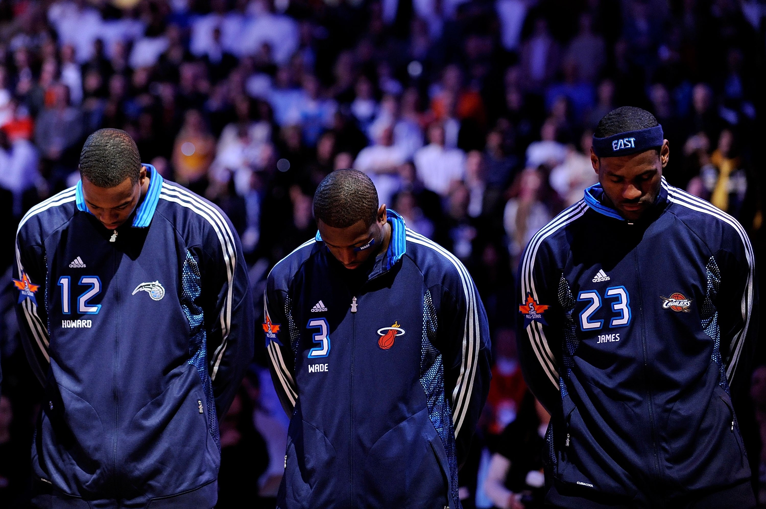 PHOENIX - FEBRUARY 15:  Dwight Howard #12, Dwyane Wade #3 and LeBron James #23 of the Eastern Conference stand during the National Anthem before the 58th NBA All-Star Game, part of 2009 NBA All-Star Weekend at US Airways Center on February 15, 2009 in Pho