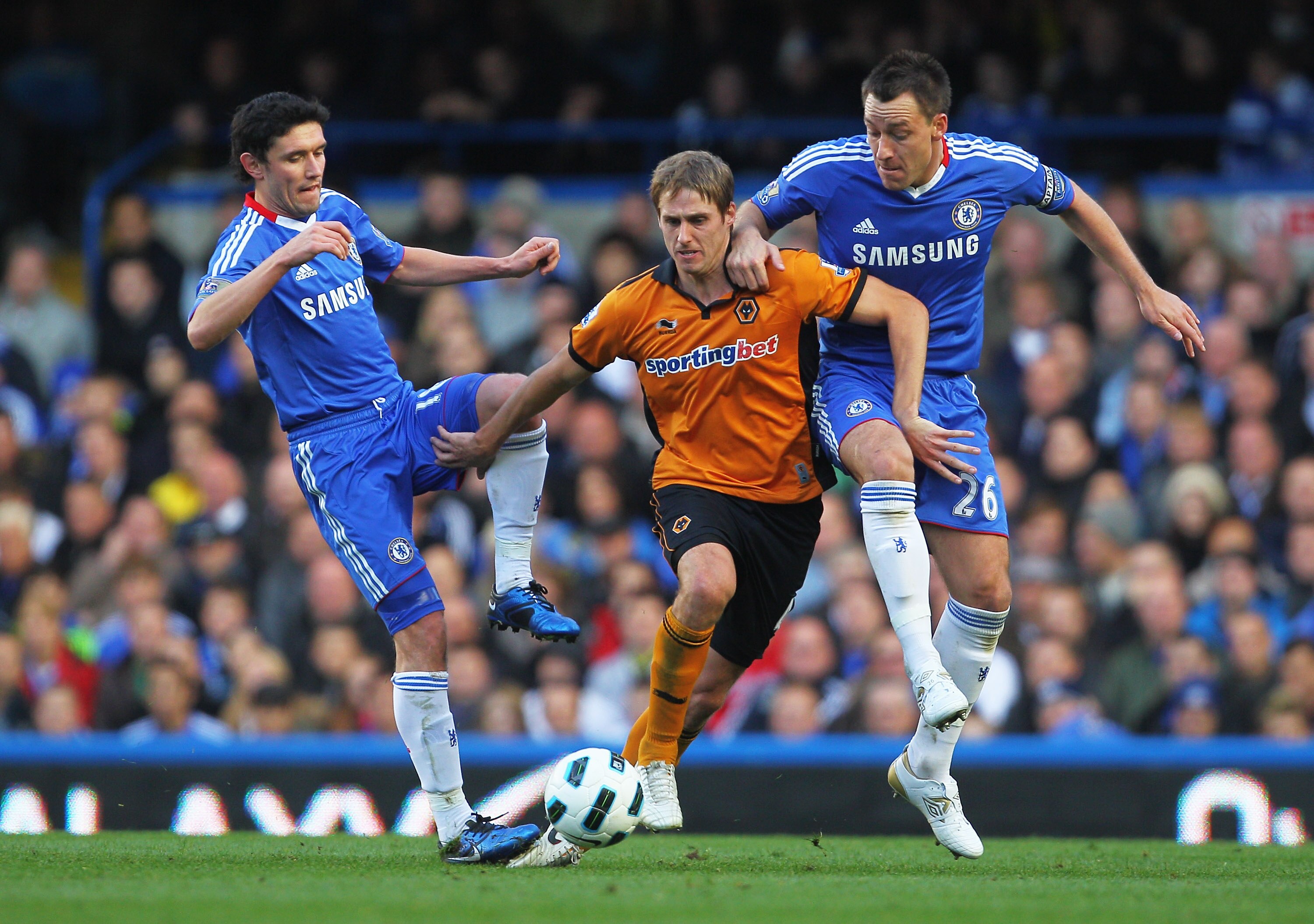 LONDON, ENGLAND - OCTOBER 23:  Dave Edwards of Wolverhampton Wanderers is closed down by Yury Zhirkov (L) and John Terry of Chelsea during the Barclays Premier League match between Chelsea and Wolverhampton Wanderers at Stamford Bridge on October 23, 2010