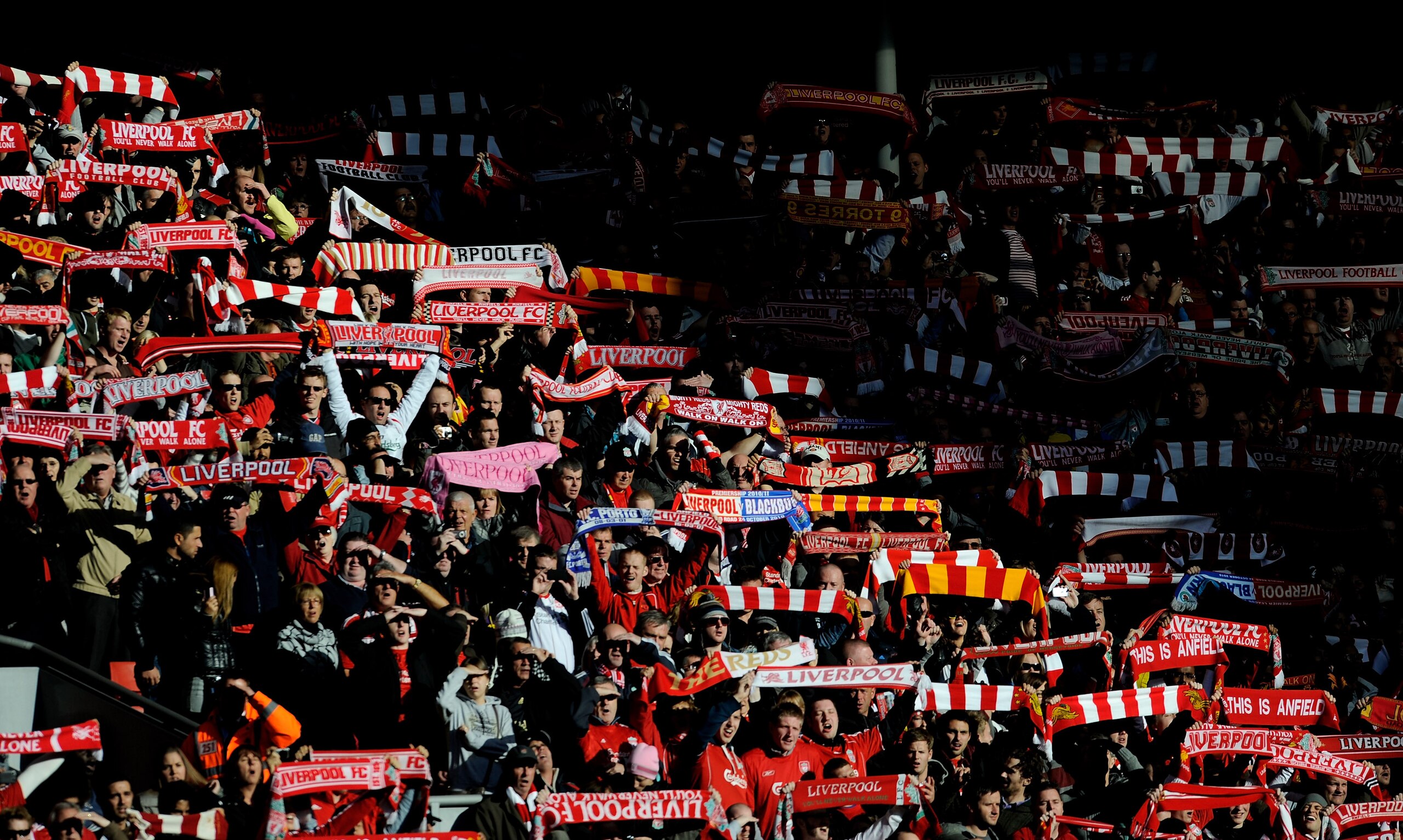 LIVERPOOL, ENGLAND - OCTOBER 24:  Liverpool fans show their support prior to the Barclays Premier League match between Liverpool and Blackburn Rovers at Anfield on October 24, 2010 in Liverpool, England. (Photo by Michael Regan/Getty Images)