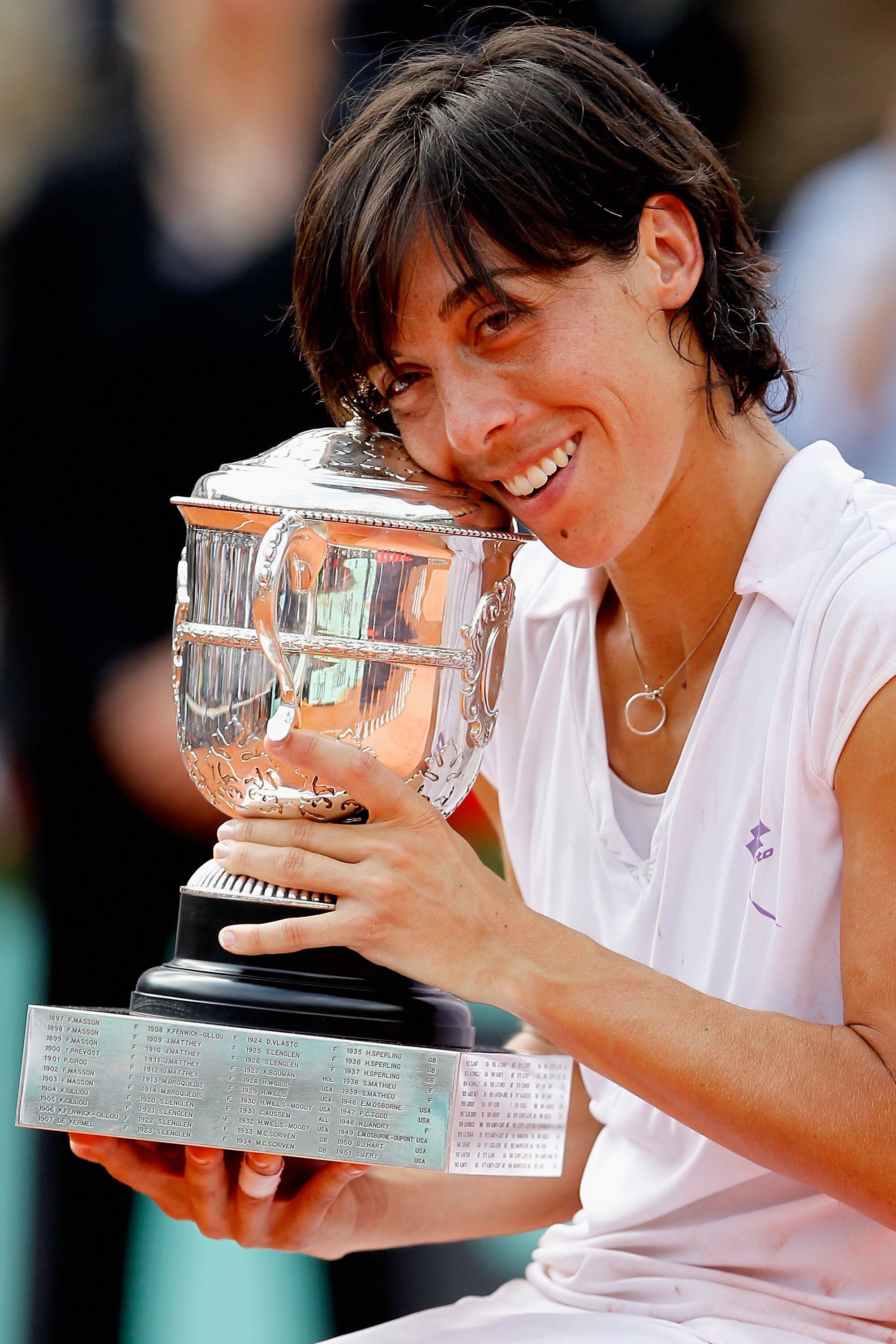 PARIS - JUNE 05:  Francesca Schiavone of Italy celebrates with the trophy after winning the women's singles final match between Francesca Schiavone of Italy and Samantha Stosur of Australia on day fourteen of the French Open at Roland Garros on June 5, 20