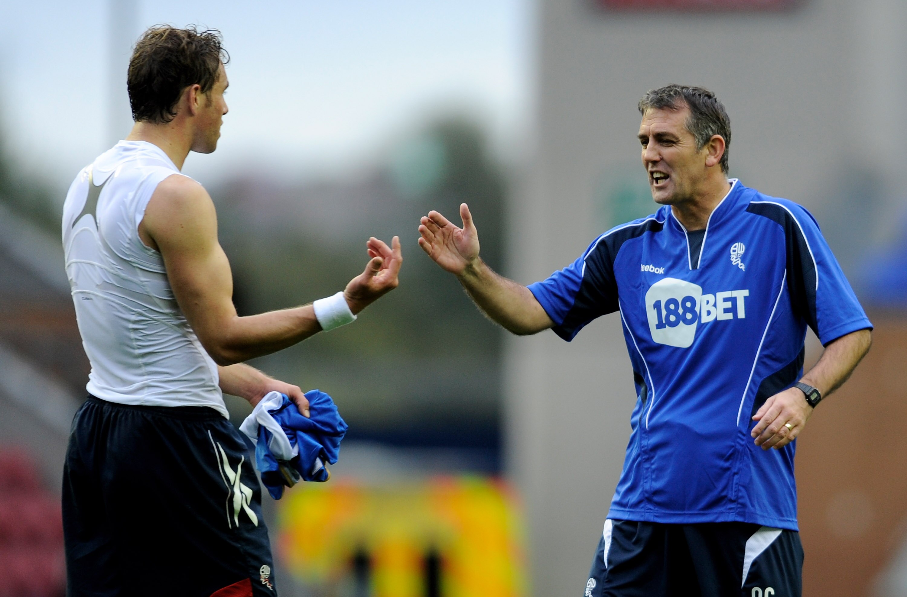 WIGAN, ENGLAND - OCTOBER 23:  Johan Elmander of Bolton Wanderers is congratulated by Manager Owen Coyle at the end of the Barclays Premier League match between Wigan Athletic and Bolton Wanderers at the DW Stadium on October 23, 2010 in Wigan, England.  (