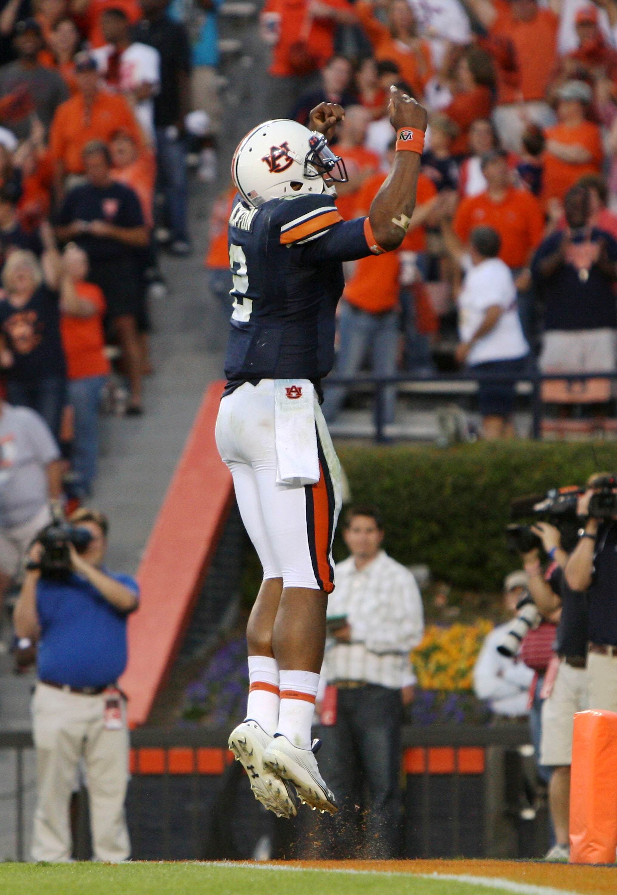 AUBURN - OCTOBER 16:  Quarterback Cam Newton #2 of the Auburn Tigers celebrates a fourth quarter touchdown during the game against the Arkansas Razorbacks at Jordan-Hare Stadium on October 16, 2010 in Auburn, Alabama.  The Tigers beat the Razorbacks 65-43