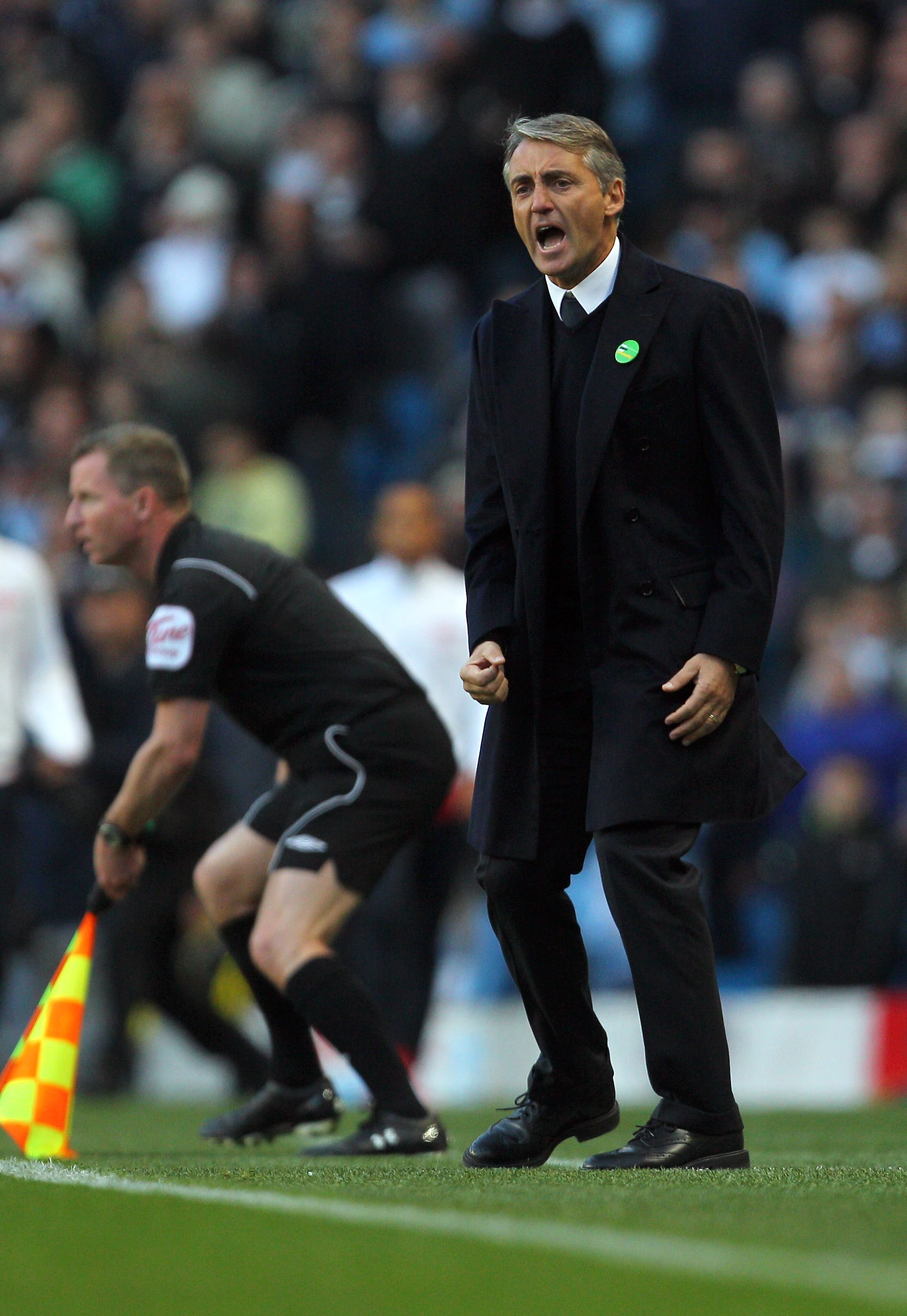 MANCHESTER, ENGLAND - OCTOBER 24:  Roberto Mancini of Manchester City reacts during the Barclays Premier League match between Manchester City and Arsenal at City of Manchester Stadium on October 24, 2010 in Manchester, England.  (Photo by Clive Rose/Getty