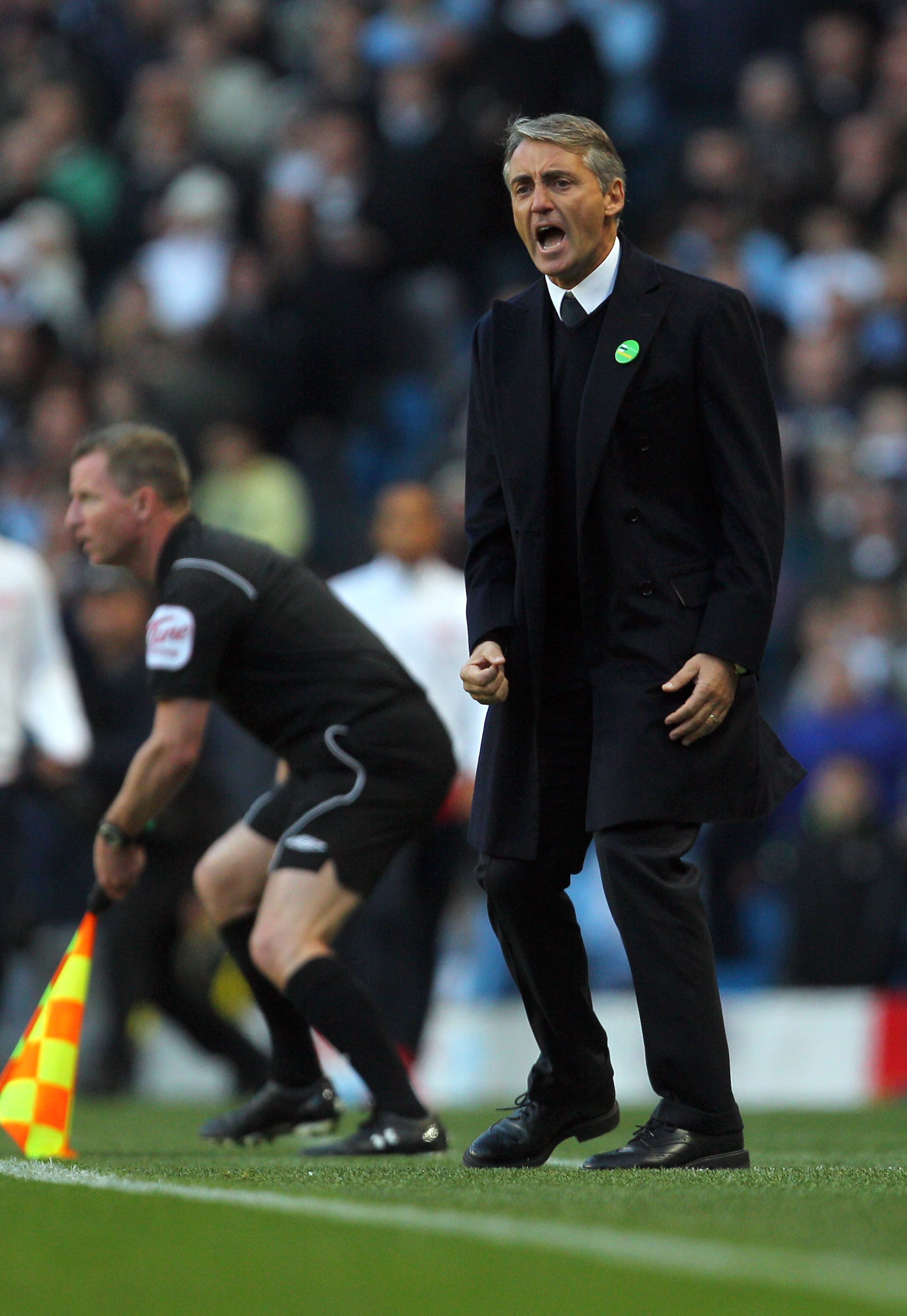 MANCHESTER, ENGLAND - OCTOBER 24:  Roberto Mancini of Manchester City reacts during the Barclays Premier League match between Manchester City and Arsenal at City of Manchester Stadium on October 24, 2010 in Manchester, England.  (Photo by Clive Rose/Getty