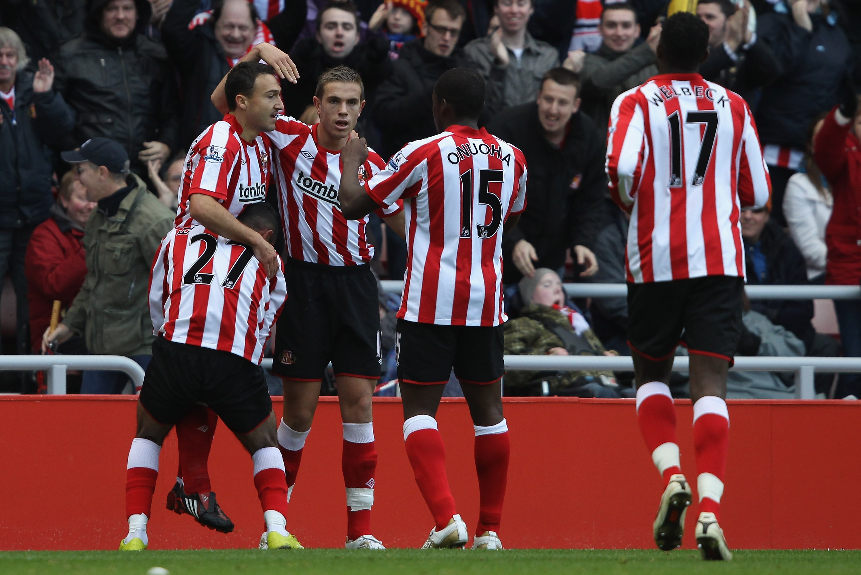 SUNDERLAND, ENGLAND - OCTOBER 23: Steed Malbranque of Sunderland is congratulated by his team mates after his cross ended up as an own goal by Richard Dunne of Aston Villa during the Barclays Premier League match between Sunderland and Aston Villa at Stad
