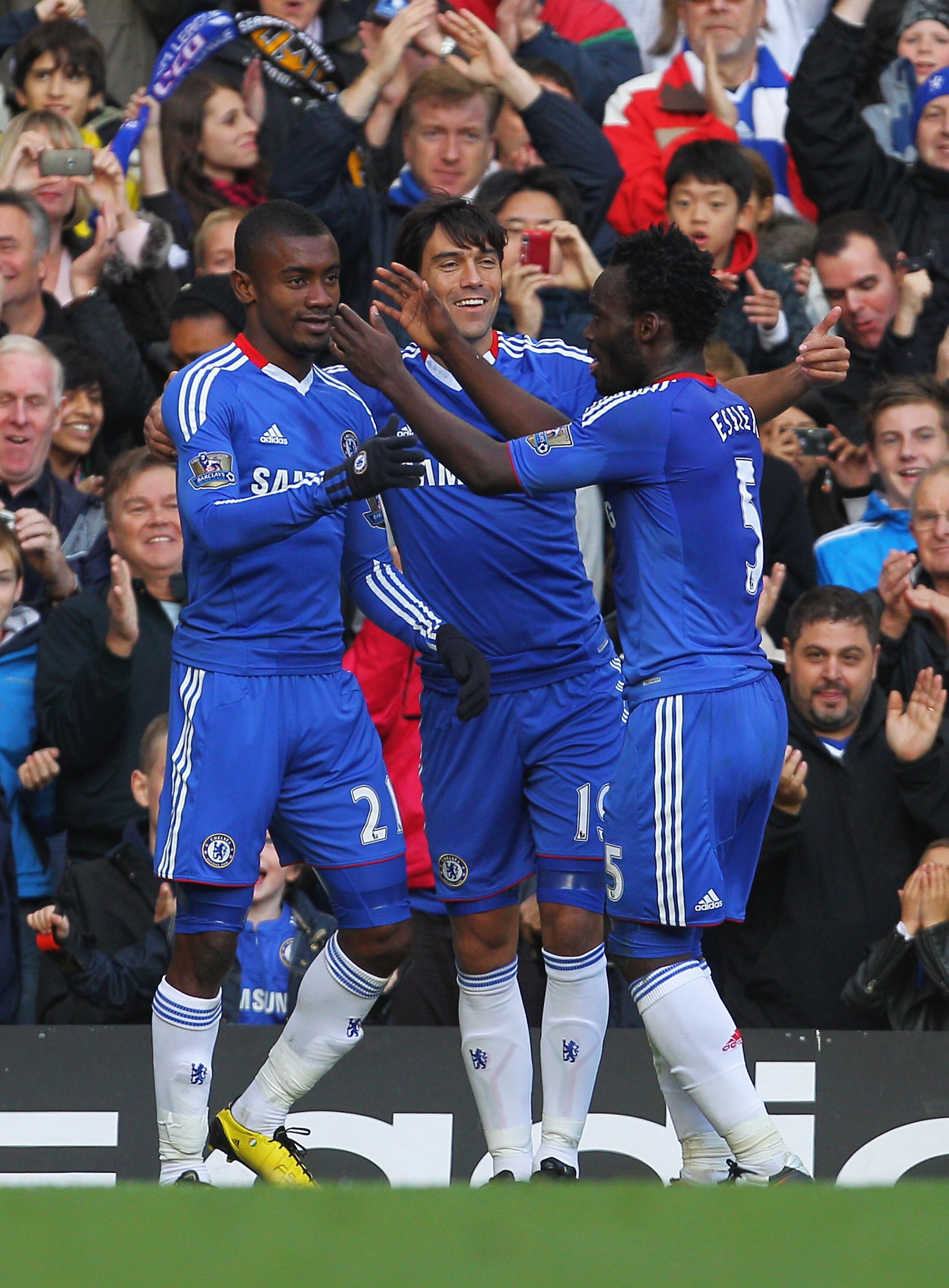 LONDON, ENGLAND - OCTOBER 23: Salomon Kalou (L) of Chelsea celebrates Chelsea's second goal with team mates Paulo Ferreira and Michael Essien (R) during the Barclays Premier League match between Chelsea and Wolverhampton Wanderers at Stamford Bridge on Oc