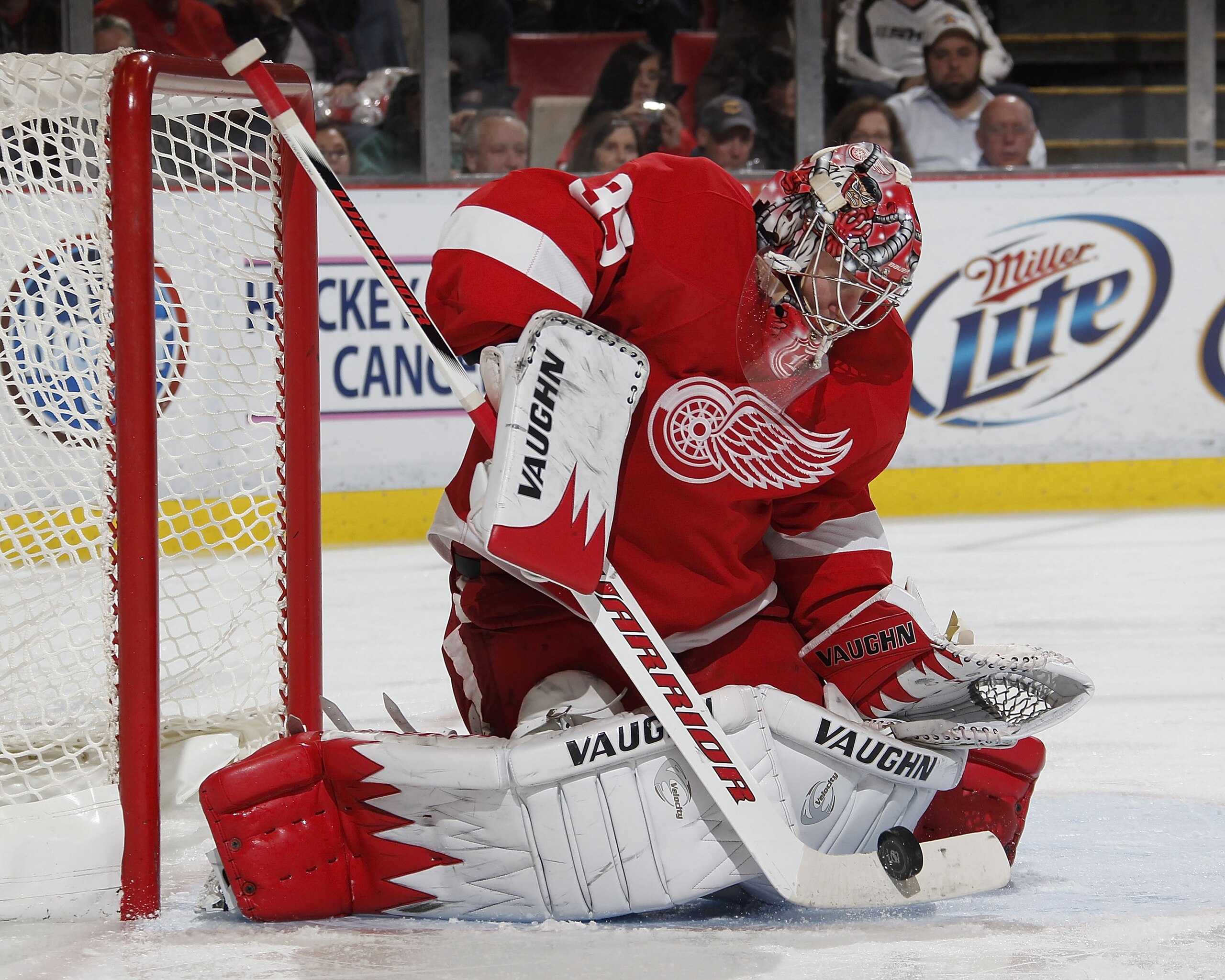 DETROIT - OCTOBER 21: Jimmy Howard #35 of the Detroit Red Wings makes a third period save while playing the Calfary Flames on October 21, 2010 at Joe Louis Arena in Detroit, Michigan. Detroit won the game 4-2. (Photo by Gregory Shamus/Getty Images)