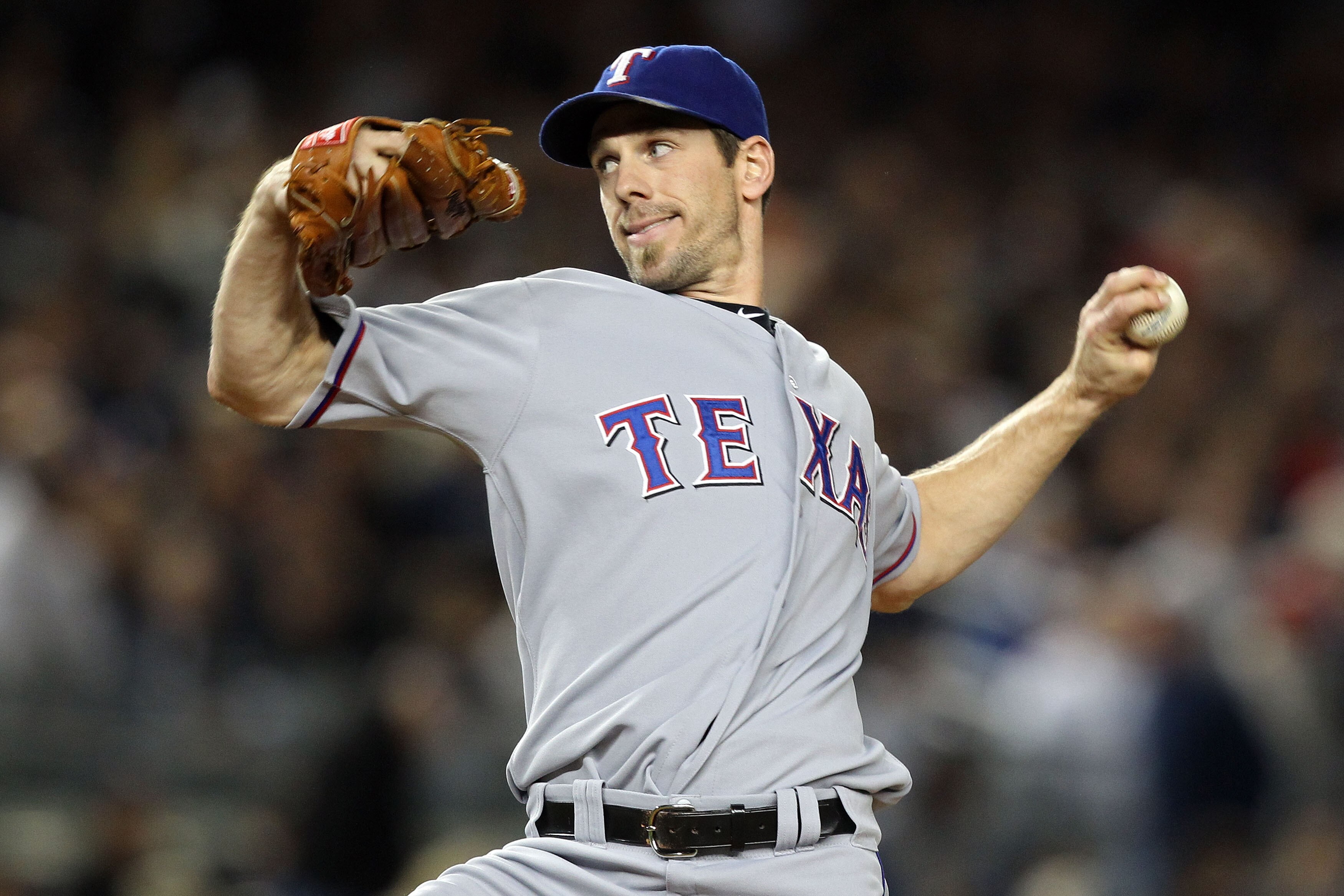 NEW YORK - OCTOBER 18:  Cliff Lee #33 of the Texas Rangers throws a pitch against the New York Yankees in Game Three of the ALCS during the 2010 MLB Playoffs at Yankee Stadium on October 18, 2010 in New York, New York.  (Photo by Al Bello/Getty Images)