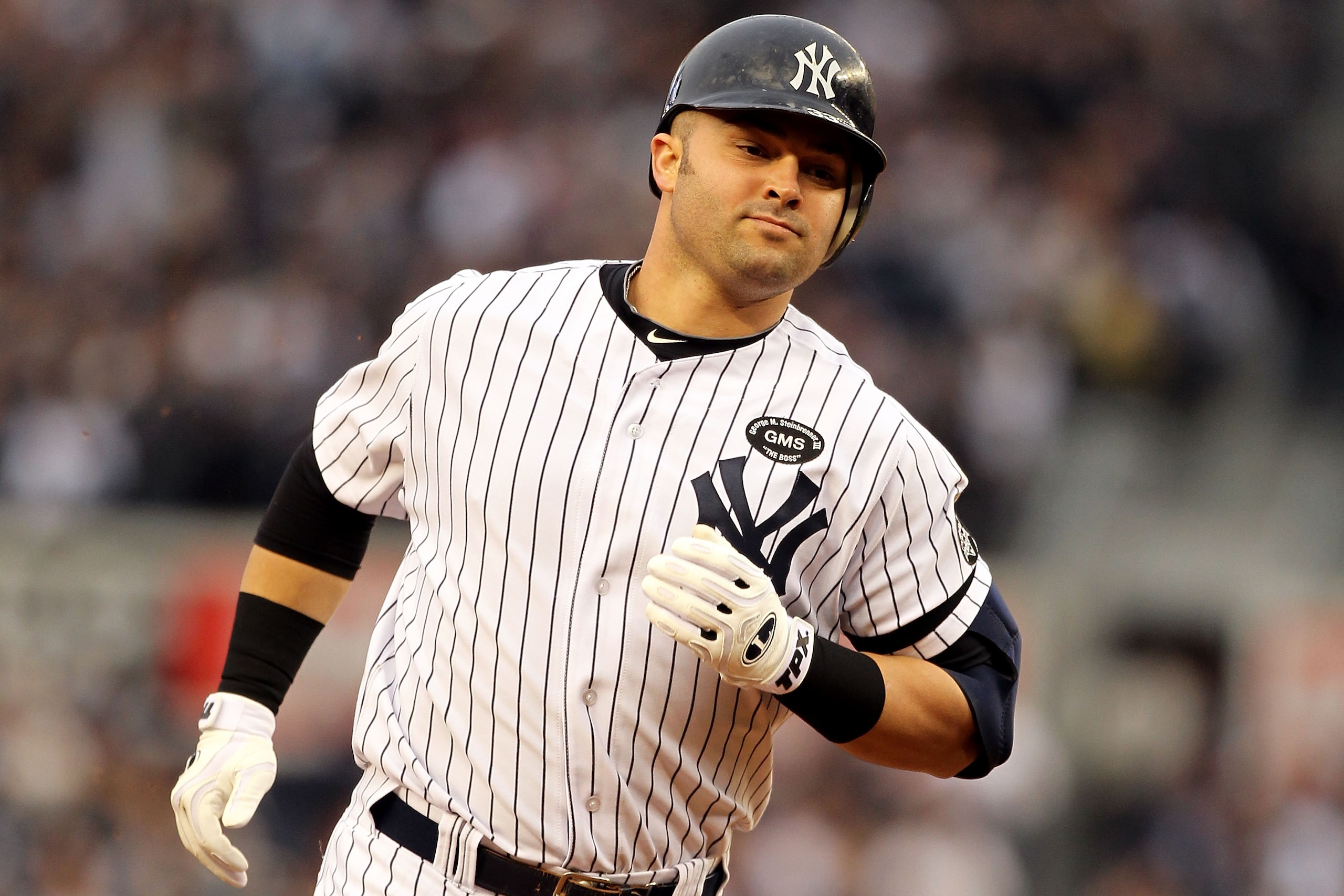NEW YORK - OCTOBER 20:  Nick Swisher #33 of the New York Yankees runs the bases on his solo home run in the bottom of the third inning against the Texas Rangers in Game Five of the ALCS during the 2010 MLB Playoffs at Yankee Stadium on October 20, 2010 in