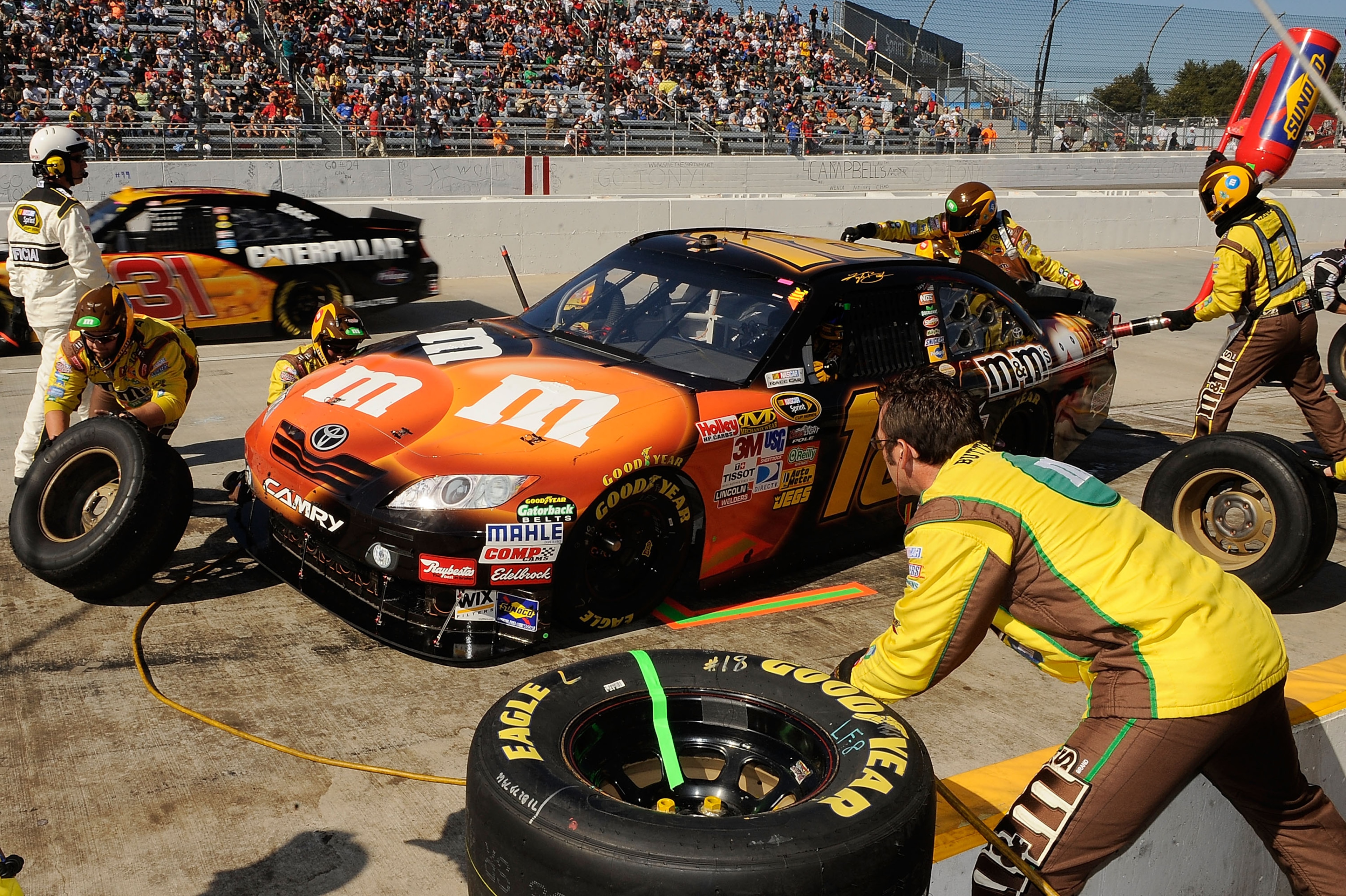 MARTINSVILLE, VA - OCTOBER 24:  Kyle Busch, driver of the #18 M&M's Toyota, pits during the NASCAR Sprint Cup Series TUMS Fast Relief 500 at Martinsville Speedway on October 24, 2010 in Martinsville, Virginia.  (Photo by Rusty Jarrett/Getty Images for NAS