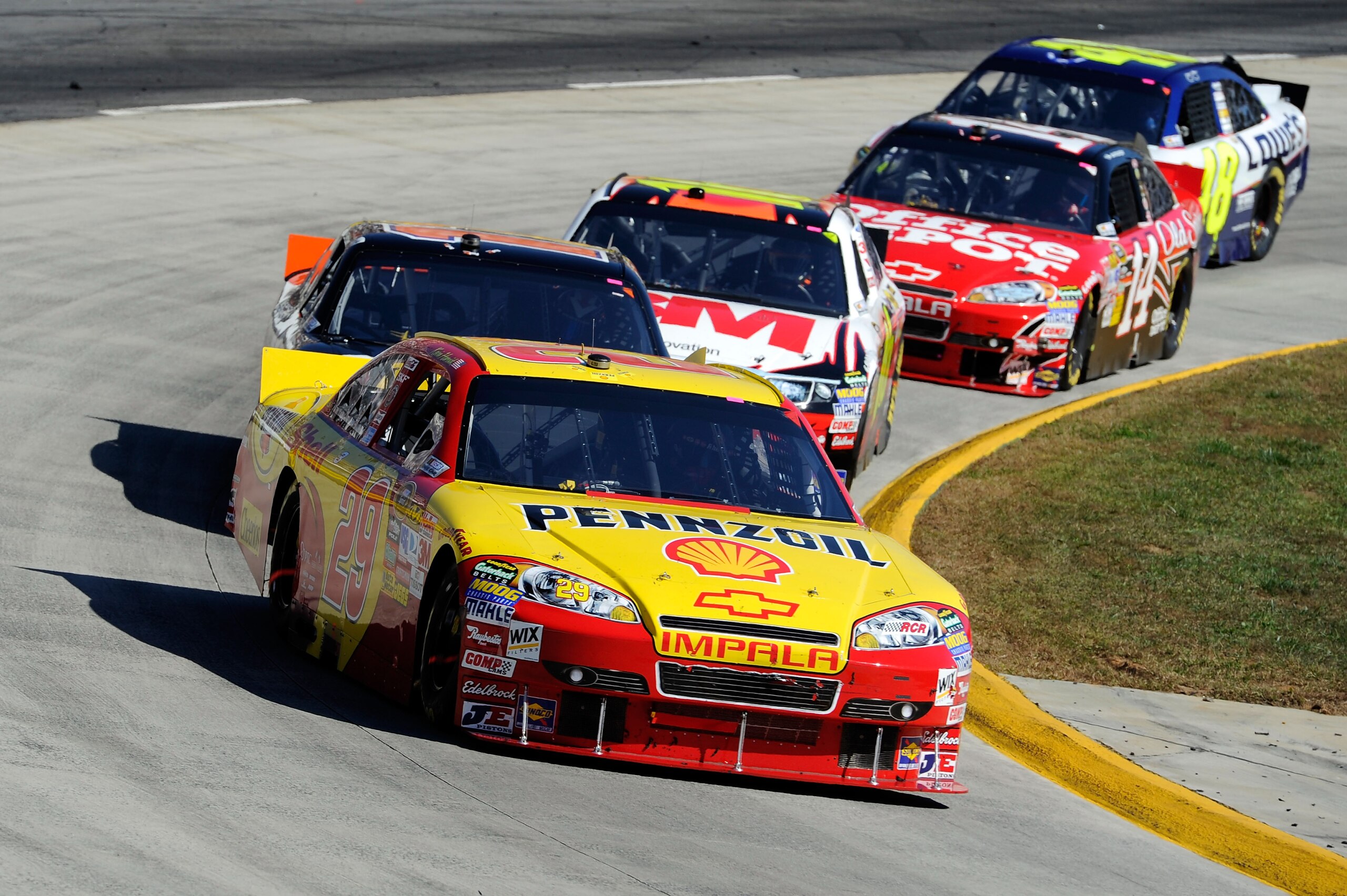 MARTINSVILLE, VA - OCTOBER 24:  Kevin Harvick, driver of the #29 Shell/Pennzoil Chevrolet,  leads a group of cars during the NASCAR Sprint Cup Series TUMS Fast Relief 500 at Martinsville Speedway on October 24, 2010 in Martinsville, Virginia.  (Photo by J