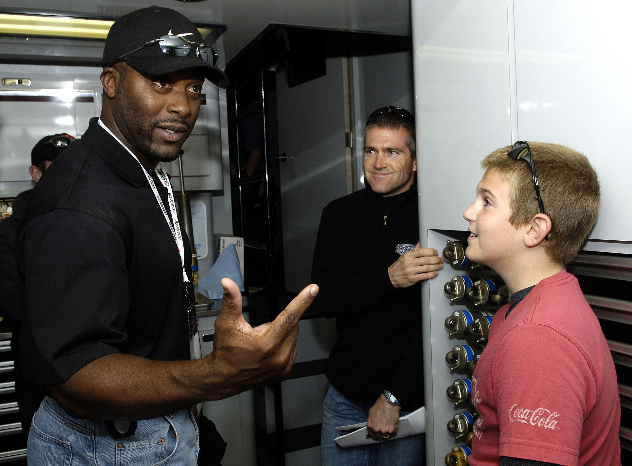 HAMPTON, GA - OCTOBER 30:  Bobby LaBonte, driver of the #18 Interstate Batterie's Chevrolet, looks on as former Atlanta Braves standout Ron Gant speaks with son Tyler LaBonte, prior to the NASCAR Nextel Cup Series Bass Pro Shops MBNA 500 on October 30, 20