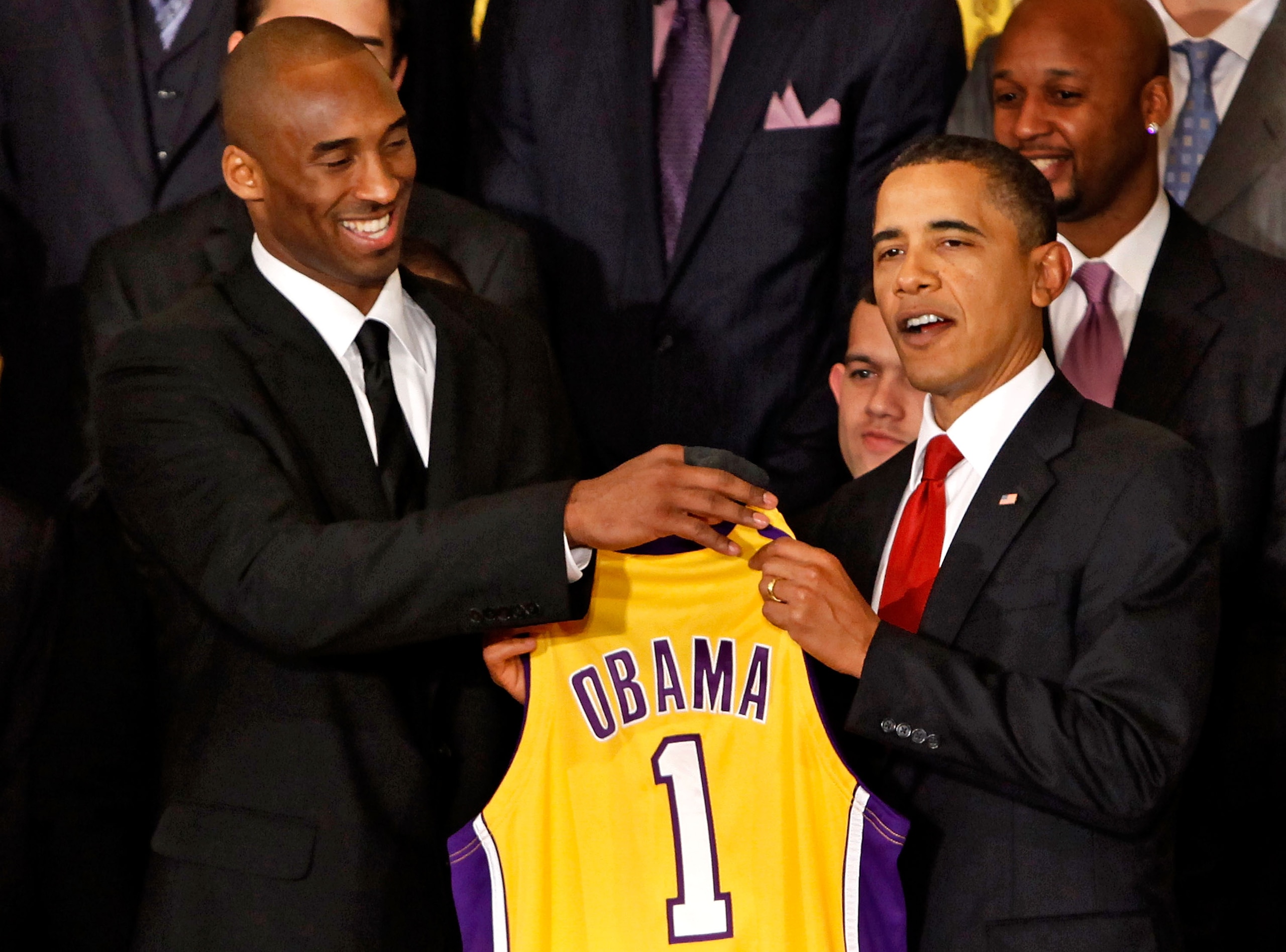 WASHINGTON - JANUARY 25:  Los Angeles Lakers guard Kobe Bryant (L) presents a jersey to President Barack Obama (R) during an event with the National Basketball Association 2009 champions in the East Room of the White House January 25, 2010 in Washington, 
