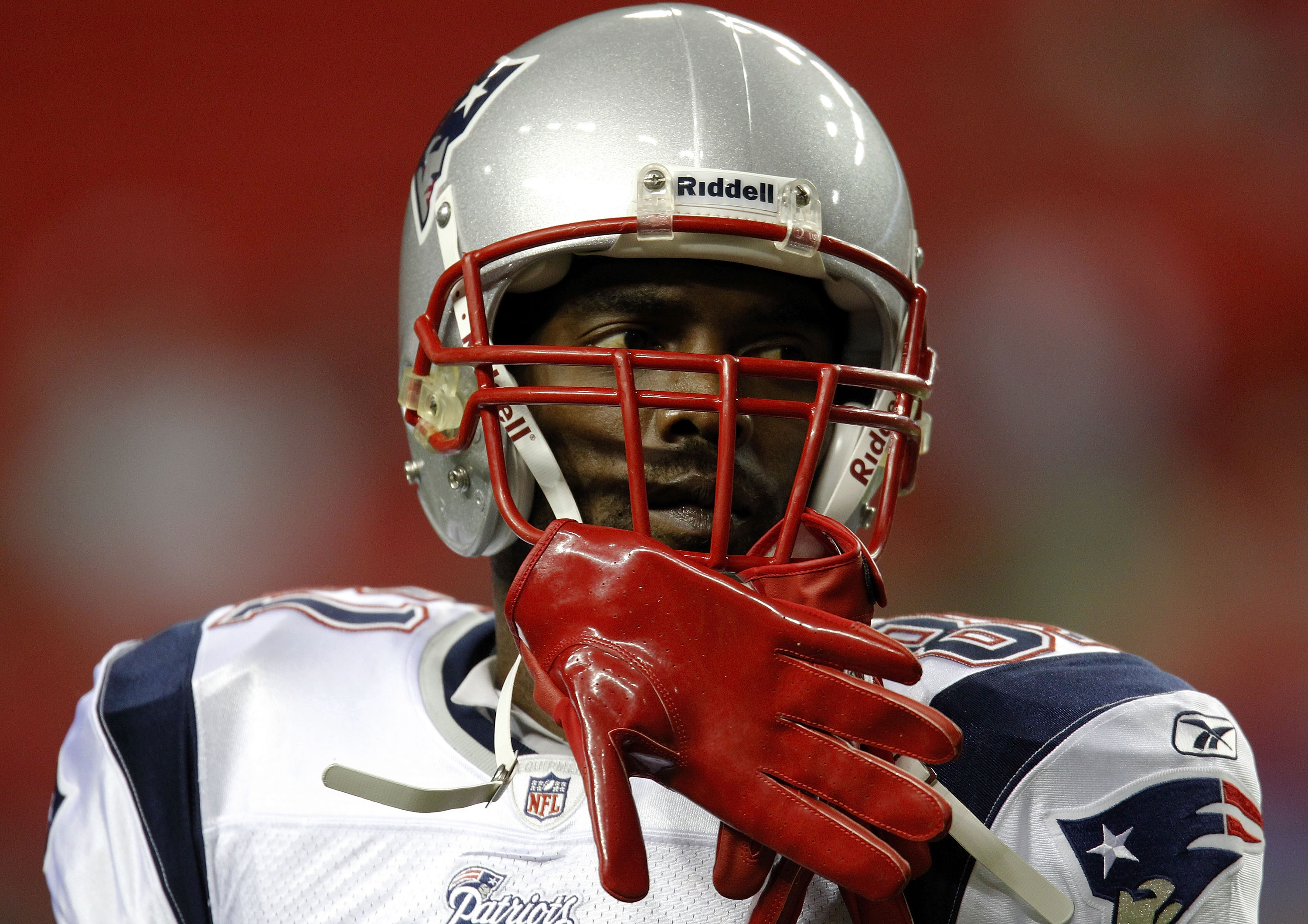 ATLANTA - AUGUST 19:  Wide receiver Randy Moss #81 of the New England Patriots takes a break during pre-game warmups before the preseason game against the Atlanta Falcons at the Georgia Dome on August 19, 2010 in Atlanta, Georgia.  (Photo by Mike Zarrilli