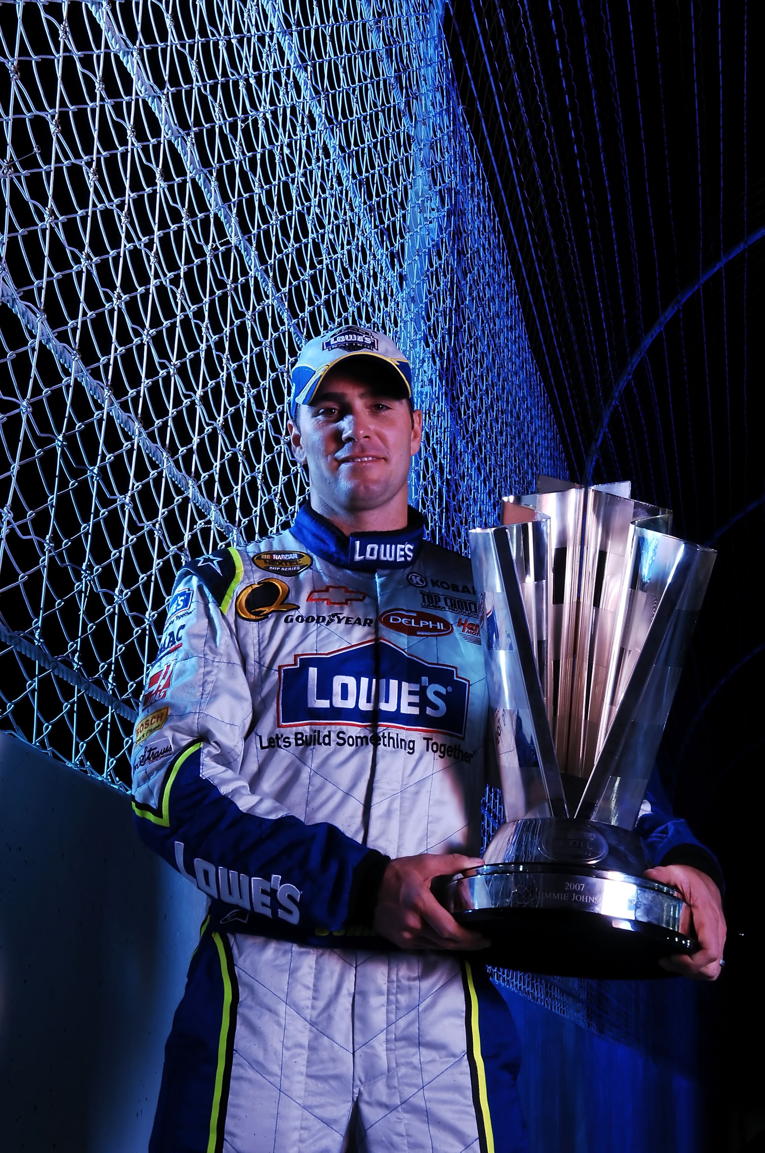 HOMESTEAD, FL - NOVEMBER 18:  Jimmie Johnson, driver of the #48 Lowe's Chevrolet, poses with the Nextel Cup Trophy after winning the NASCAR Nextel Cup Series at Homestead-Miami Speedway on November 18, 2007 in Homestead, Florida.  (Photo by Marc Serota/Ge