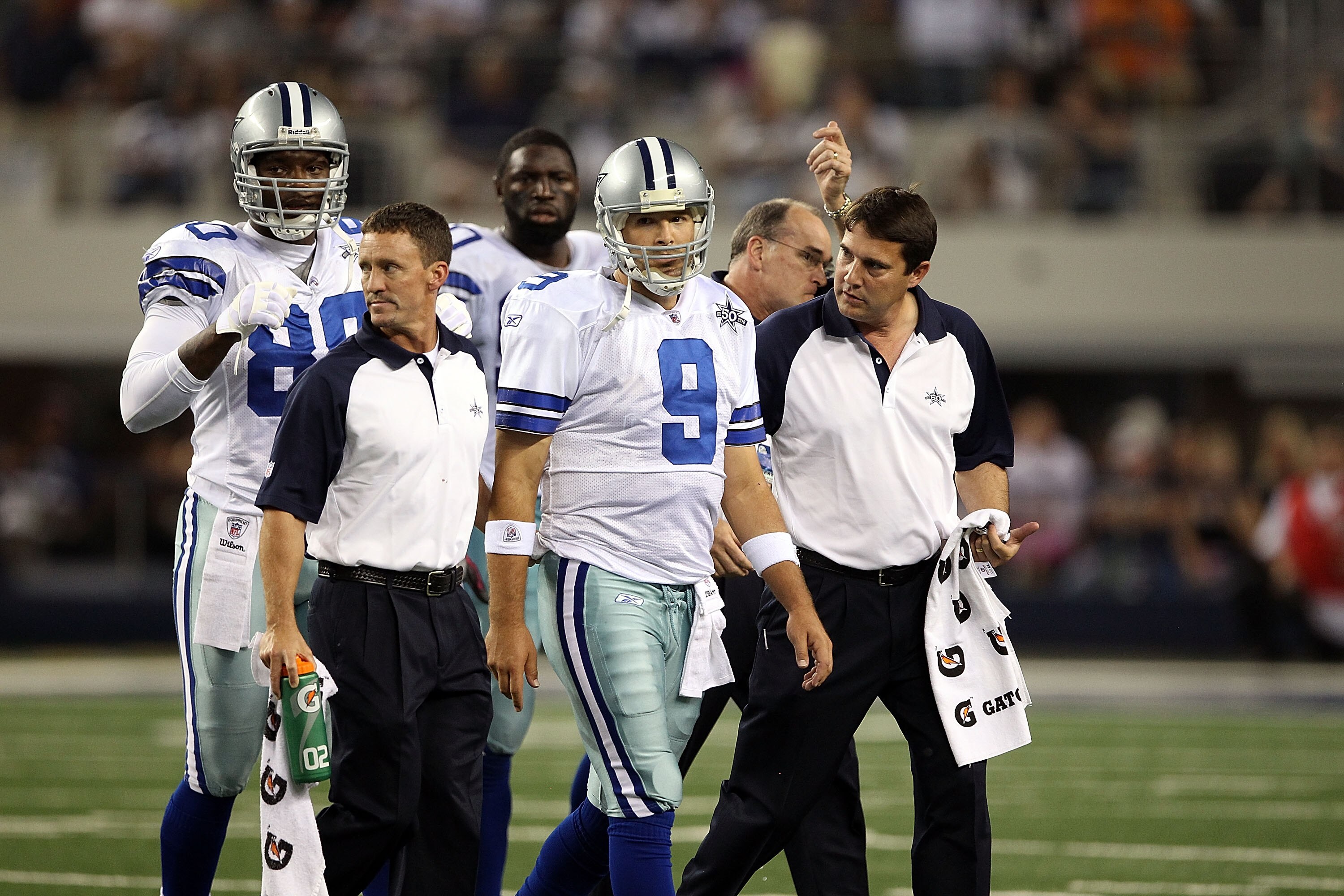 ARLINGTON, TX - OCTOBER 25:  Quarterback Tony Romo #9 of the Dallas Cowboys leaves the game after a left shoulder injury in the second quarter against the New York Giants at Cowboys Stadium on October 25, 2010 in Arlington, Texas.  (Photo by Ronald Martin
