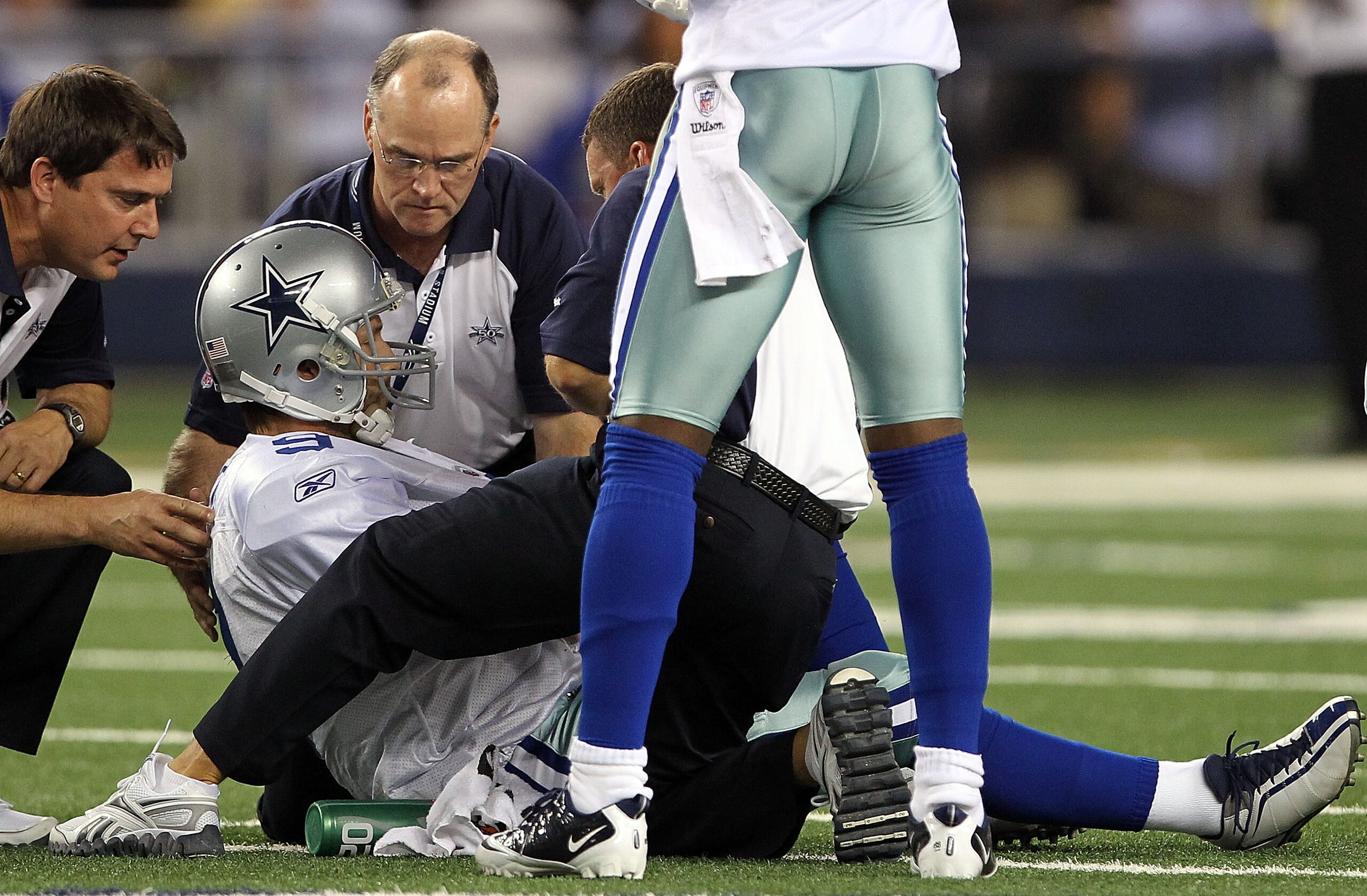 ARLINGTON, TX - OCTOBER 25:  Quarterback Tony Romo #9 of the Dallas Cowboys lies on the field after a left shoulder injury in the second quarter against the New York Giants at Cowboys Stadium on October 25, 2010 in Arlington, Texas.  (Photo by Ronald Mart