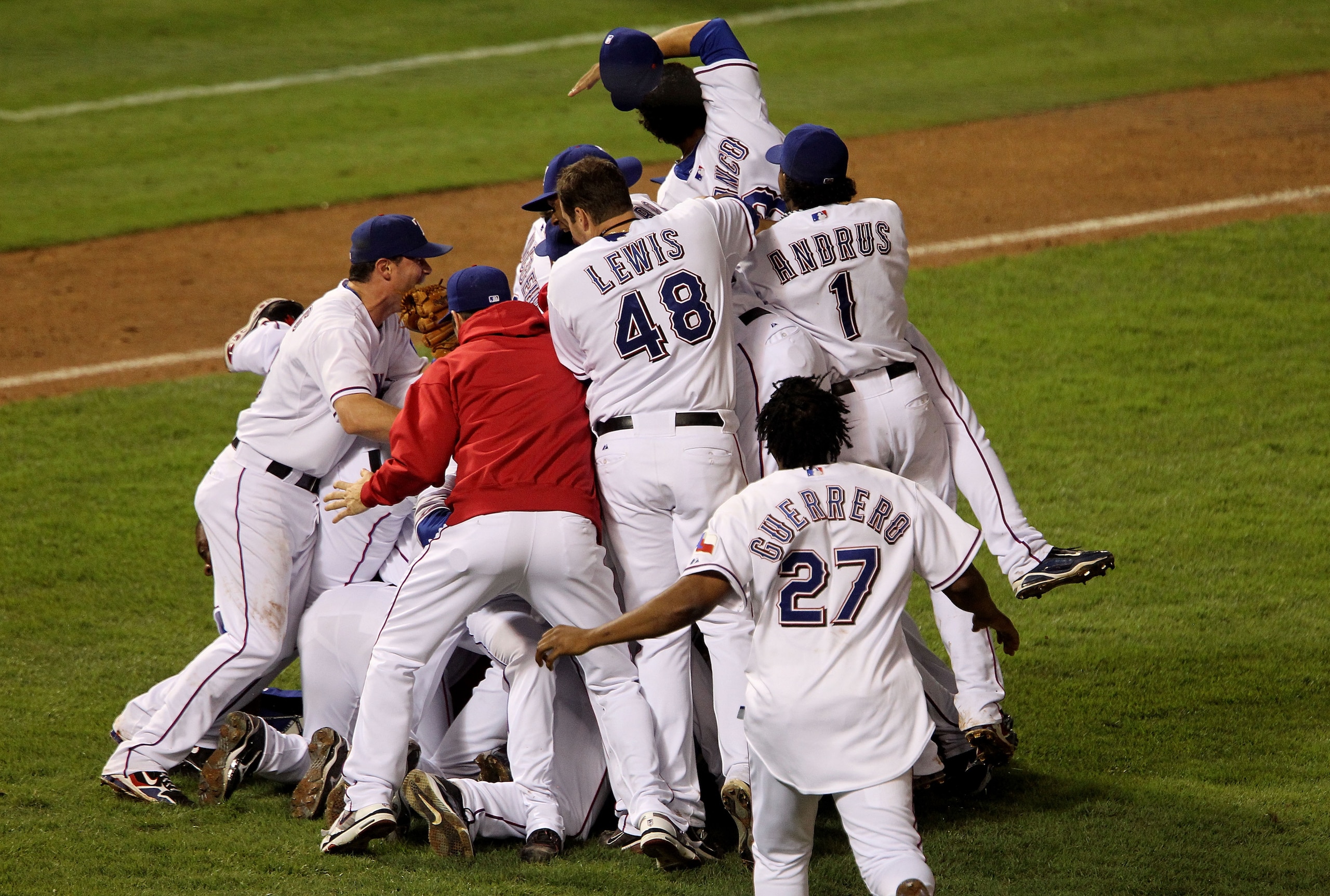 ARLINGTON, TX - OCTOBER 22: The Texas Rangers celebrate on the field after defeating the New York Yankees 6-1 in Game Six of the ALCS to advance to the World Series during the 2010 MLB Playoffs at Rangers Ballpark in Arlington on October 22, 2010 in Arli ARLINGTON, TX - OCTOBER 22: The Texas Rangers celebrate on the field after defeating the New York Yankees 6-1 in Game Six of the ALCS to advance to the World Series during the 2010 MLB Playoffs at Rangers Ballpark in Arlington on October 22, 2010 in Arli