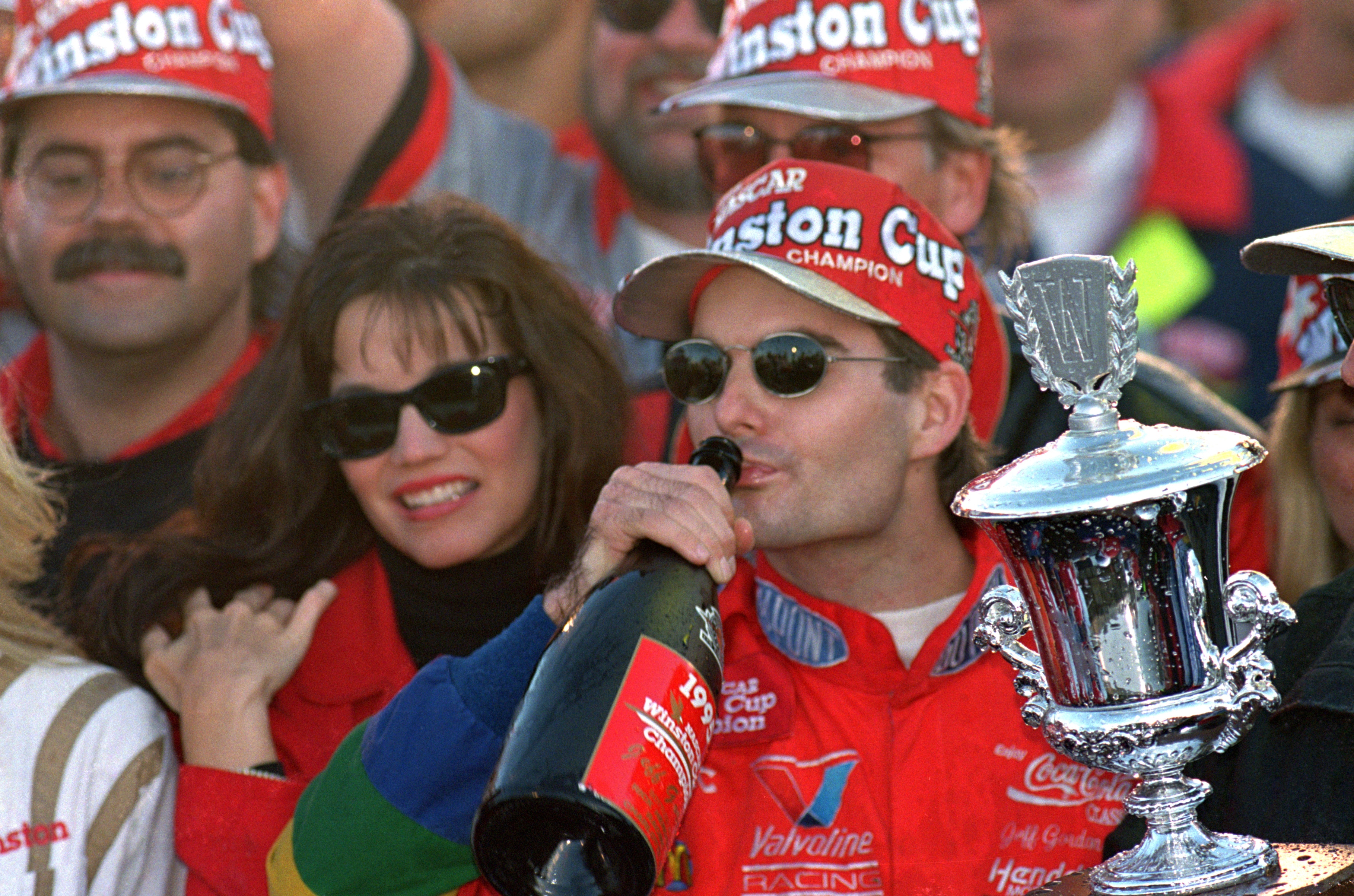 ATLANTA - NOVEMBER 12:  Jeff Gordon of DuPont Chevrolet celebrates in victory lane drinking champagne after winning the Winston Cup championship in the NASCAR NAPA 500 at the Atlantic Motor Speedway on November 12, 1995 in Atlanta, Georgia.  (Photo by Dav