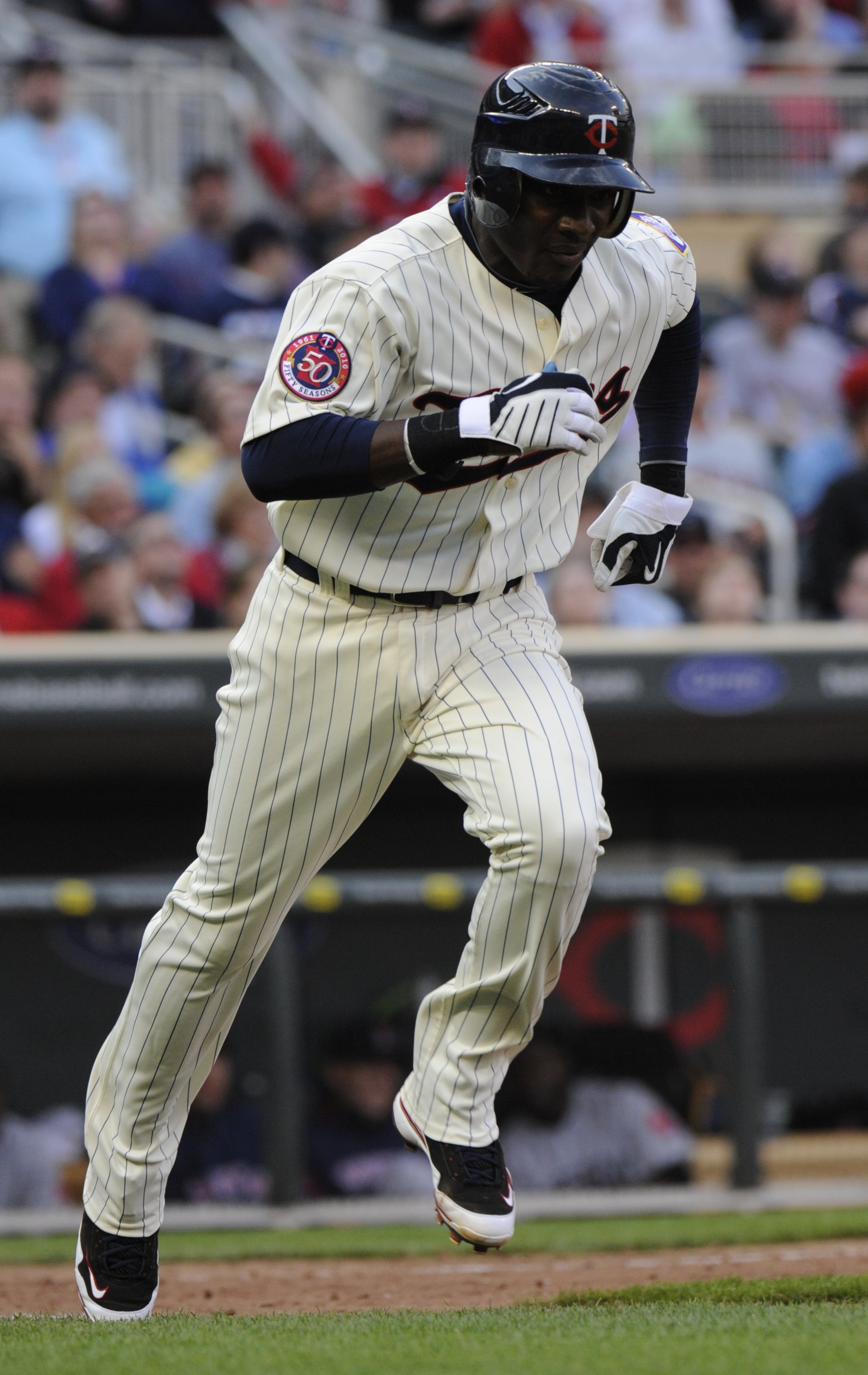 MINNEAPOLIS, MN - APRIL 12: Orlando Hudson #1 of the Minnesota Twins runs to first in the eighth inning against the Boston Red Sox during the Twins home opener at Target Field on April 12, 2010 in Minneapolis, Minnesota. (Photo by Hannah Foslien /Getty Im