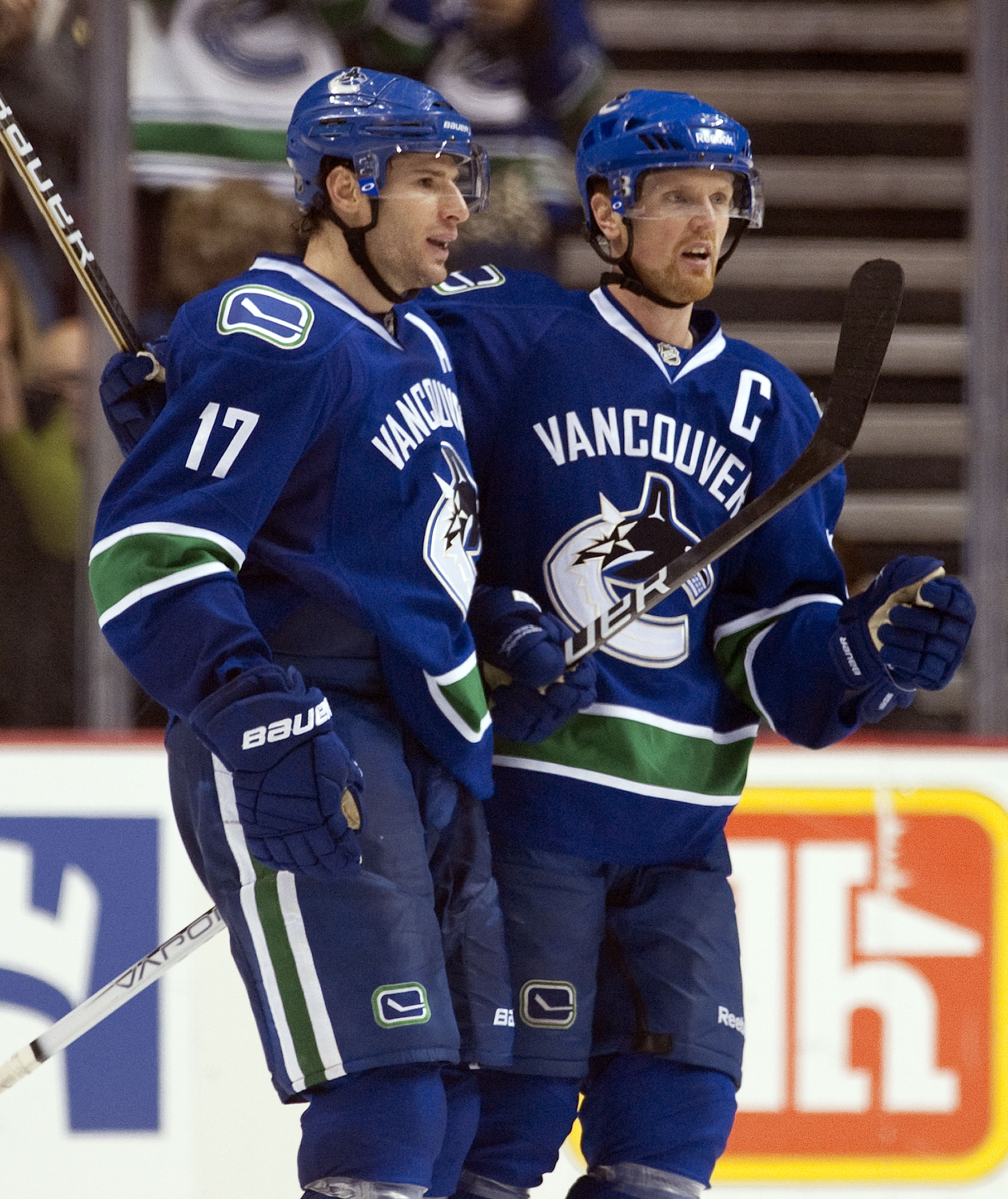 VANCOUVER, CANADA - OCTOBER 17: Ryan Kesler #17 of the Vancouver Canucks celebrates with Henrik Sedin #33 after scoring against the Carolina Hurricanes during the third period in NHL action on October 17, 2010 at Rogers Arena in Vancouver, British Columbi
