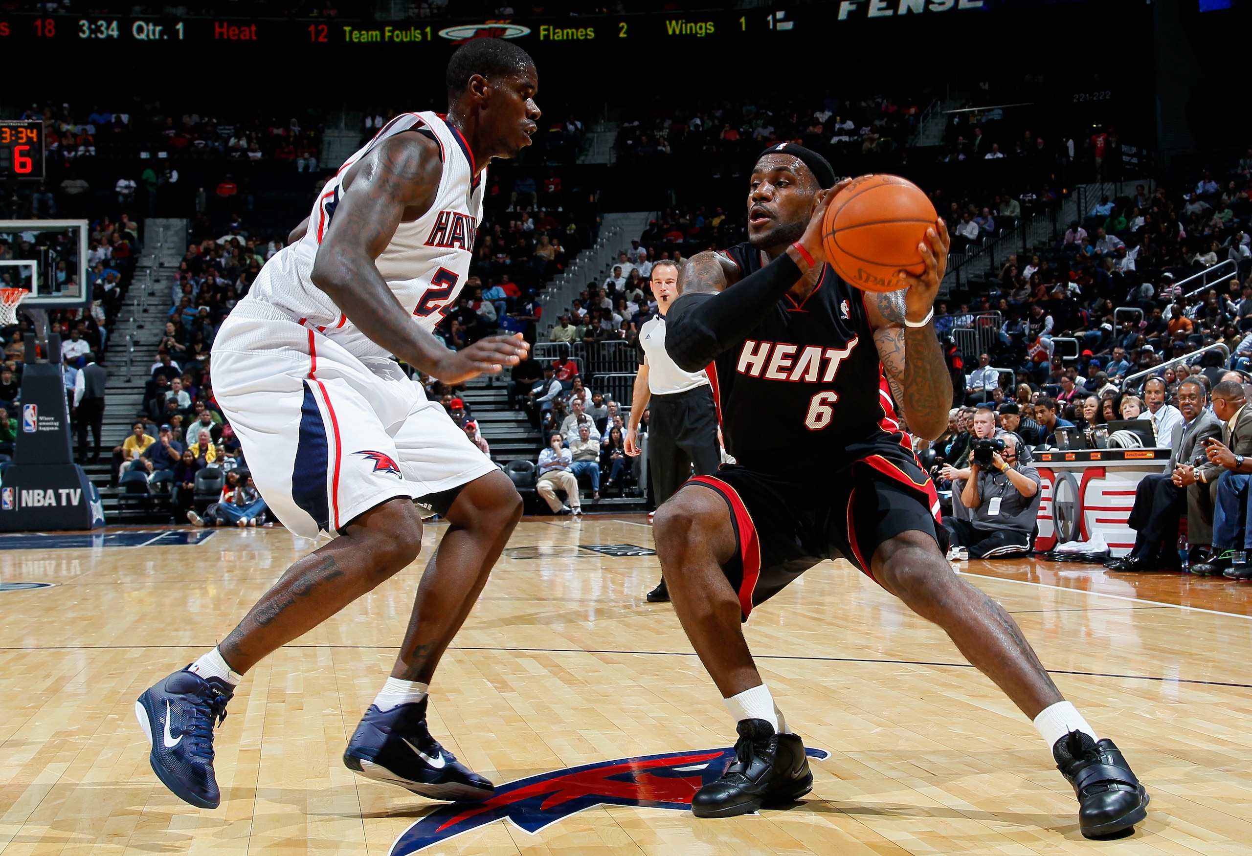 ATLANTA - OCTOBER 21:  LeBron James #6 of the Miami Heat drives against Marvin Williams #24 of the Atlanta Hawks at Philips Arena on October 21, 2010 in Atlanta, Georgia.  (Photo by Kevin C. Cox/Getty Images)