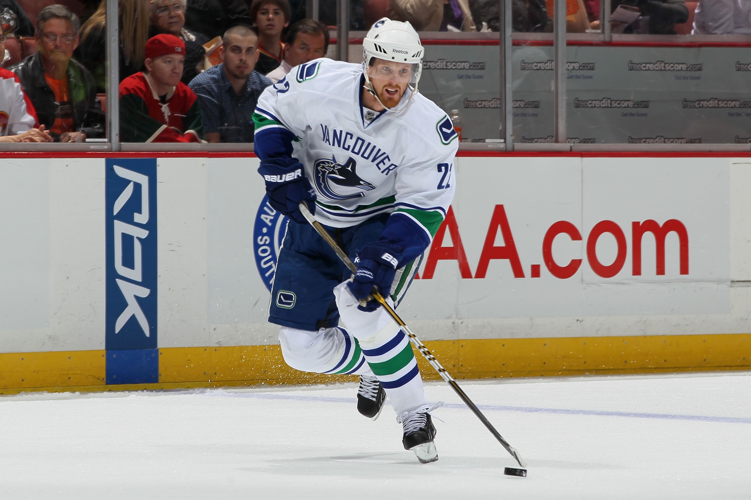 ANAHEIM, CA - OCTOBER 13:  Daniel Sedin #22 of the Vancouver Canucks controls the puck against the Anaheim Ducks during their game at Honda Center on October 13, 2010 in Anaheim, California.  (Photo by Jeff Gross/Getty Images)