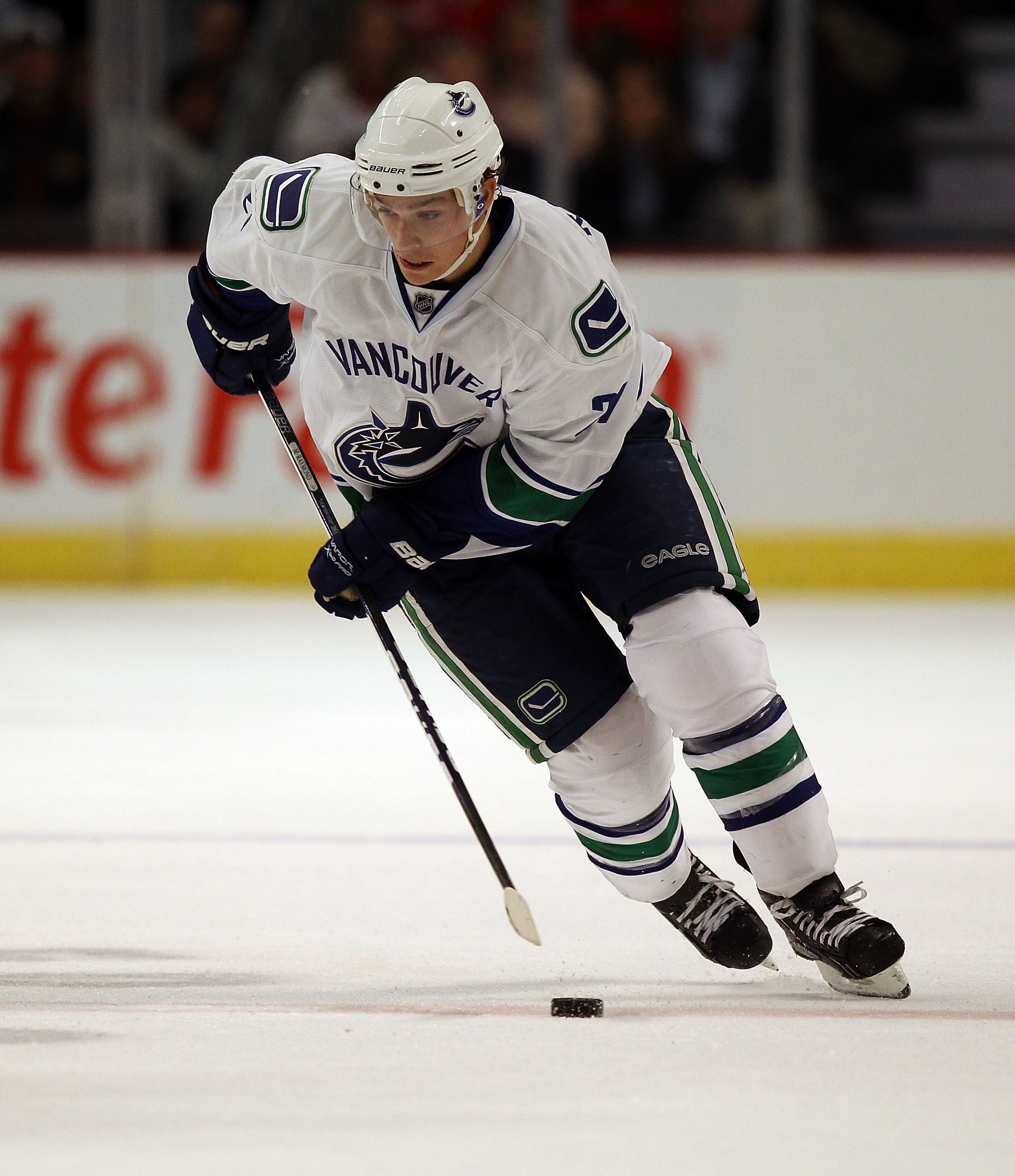 CHICAGO - OCTOBER 20: Mason Raymond #21 of the Vancouver Canucks skates up the ice against the Chicago Blackhawks at the United Center on October 20, 2010 in Chicago, Illinois. The Blackhawks defeated the Canucks 2-1 in overtime. (Photo by Jonathan Daniel